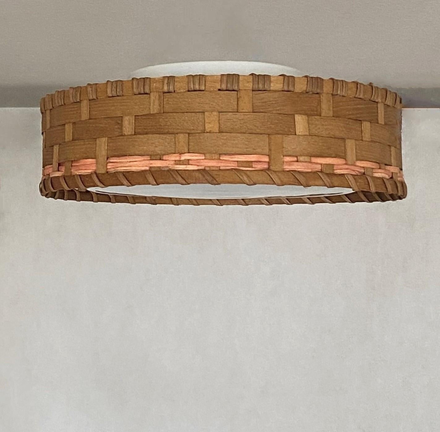 Mid-Century Modern Scandinavian design flush mount, 1960s, woven wicker basket around a Murano glass diffuser. This beaufiful piece is in very good vintage condition, no damages, rewired. It takes an E27 srew bulb up to 60watt. LED bulbs can also be