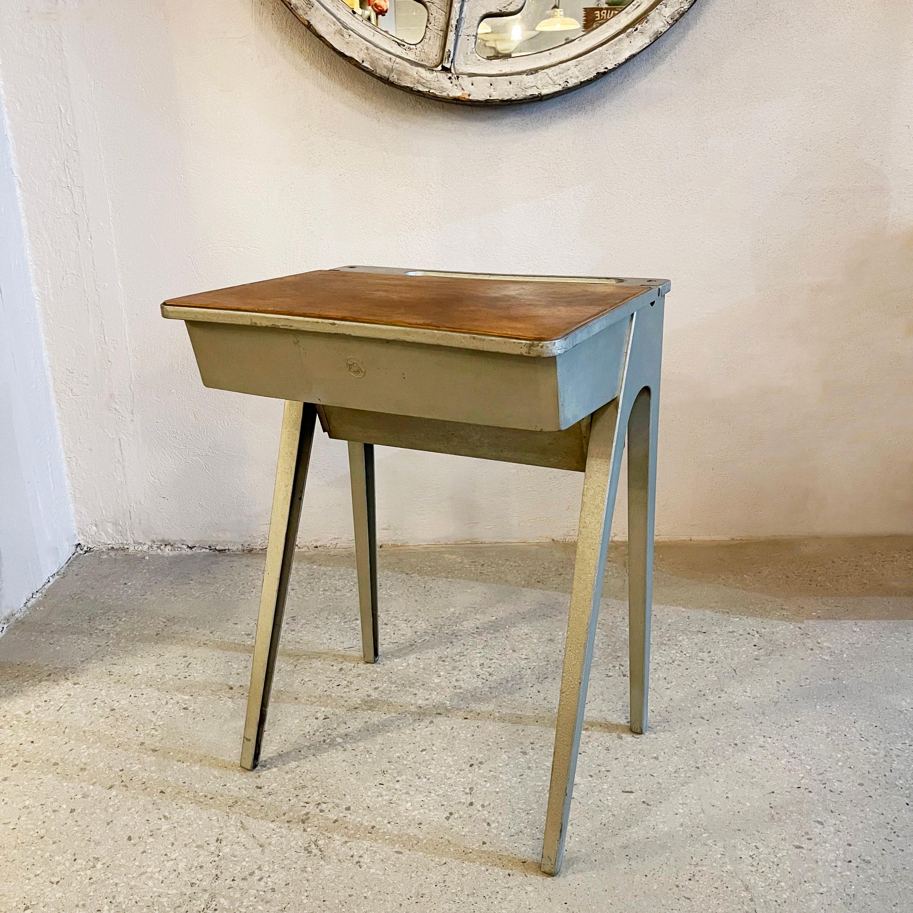 Rare, mid-Century Modern, birch veneer and cast aluminum school desk designed by English designer James W. Leonard features a flip top with interior storage. Manufactured by the Education Supply Association (Esavian Ltd), with the ESA mark cast on