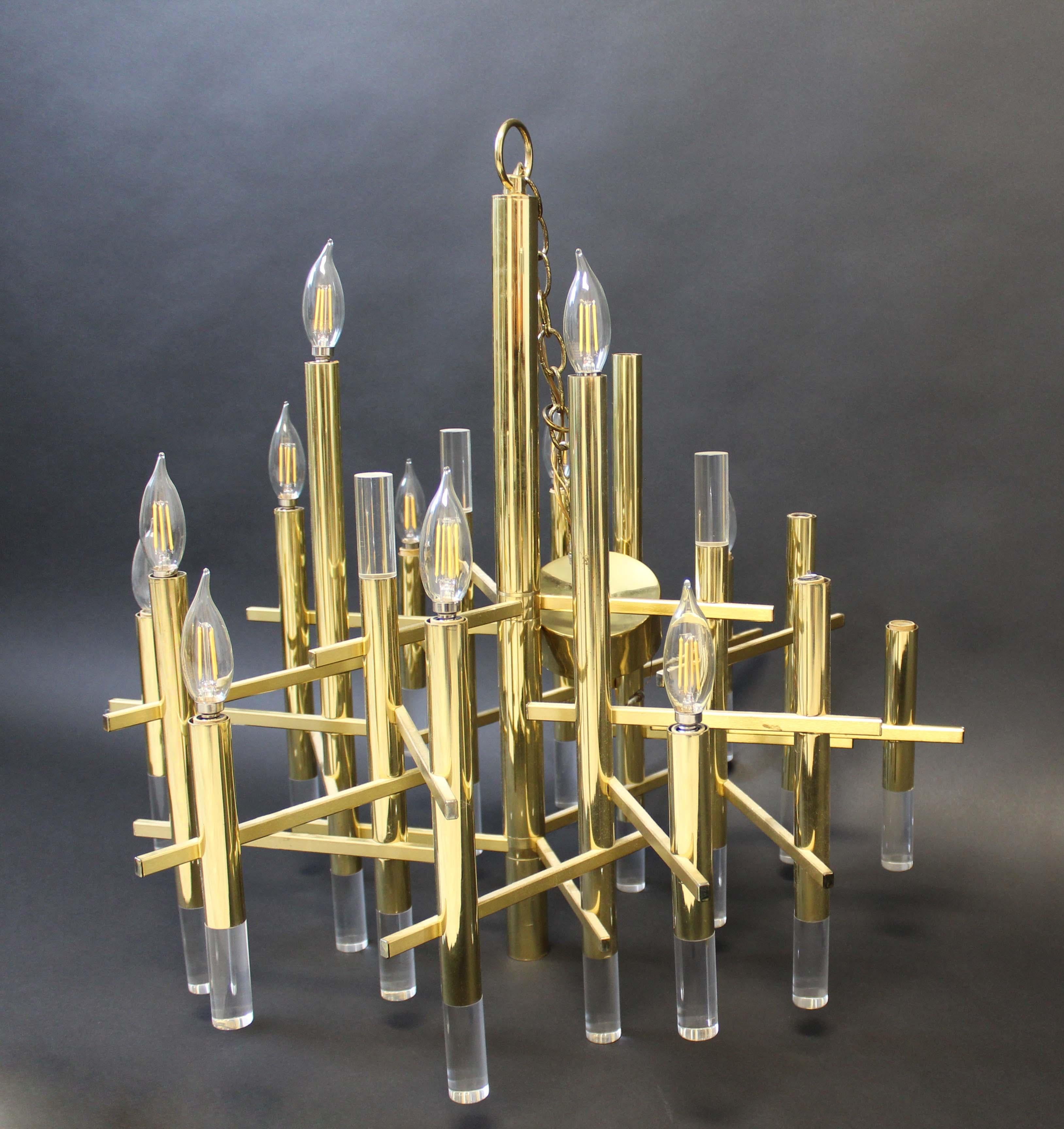 Stunning, multi-arm brass chandelier with Lucite details, making this a focal point to any dining room whether traditional or modern.

In very good condition, with little or no imperfections. Hardwired.

Dimensions: 26.5