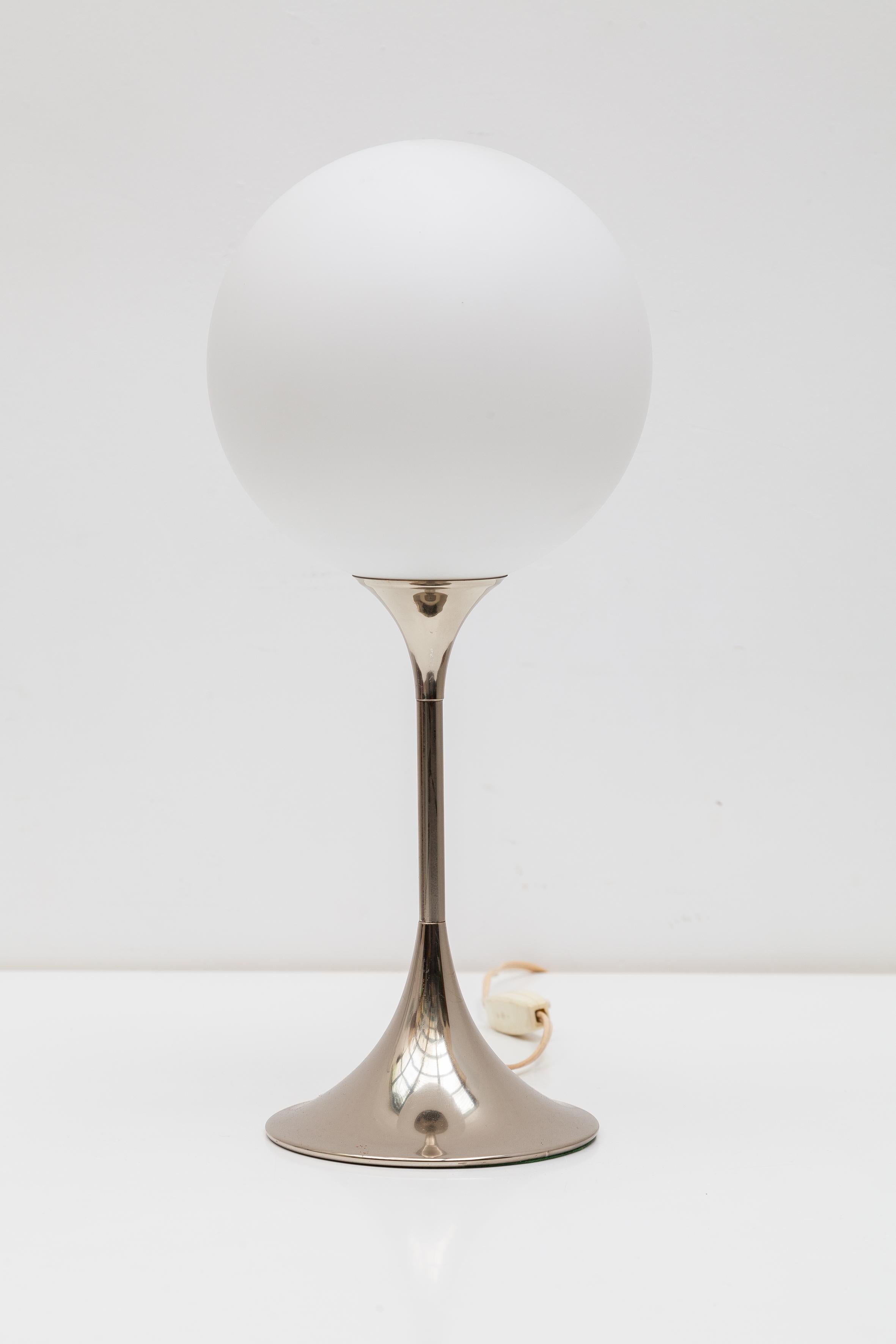 Mid-Century Modern chrome 'trumpet' table lamp with opaline glass globe designed by Gaetano Sciolari.
Dimensions: Table lamp: 20 W x 50 H x 20 W cm.

Also available one floor-lamp and one Uplighter Chandelier.

