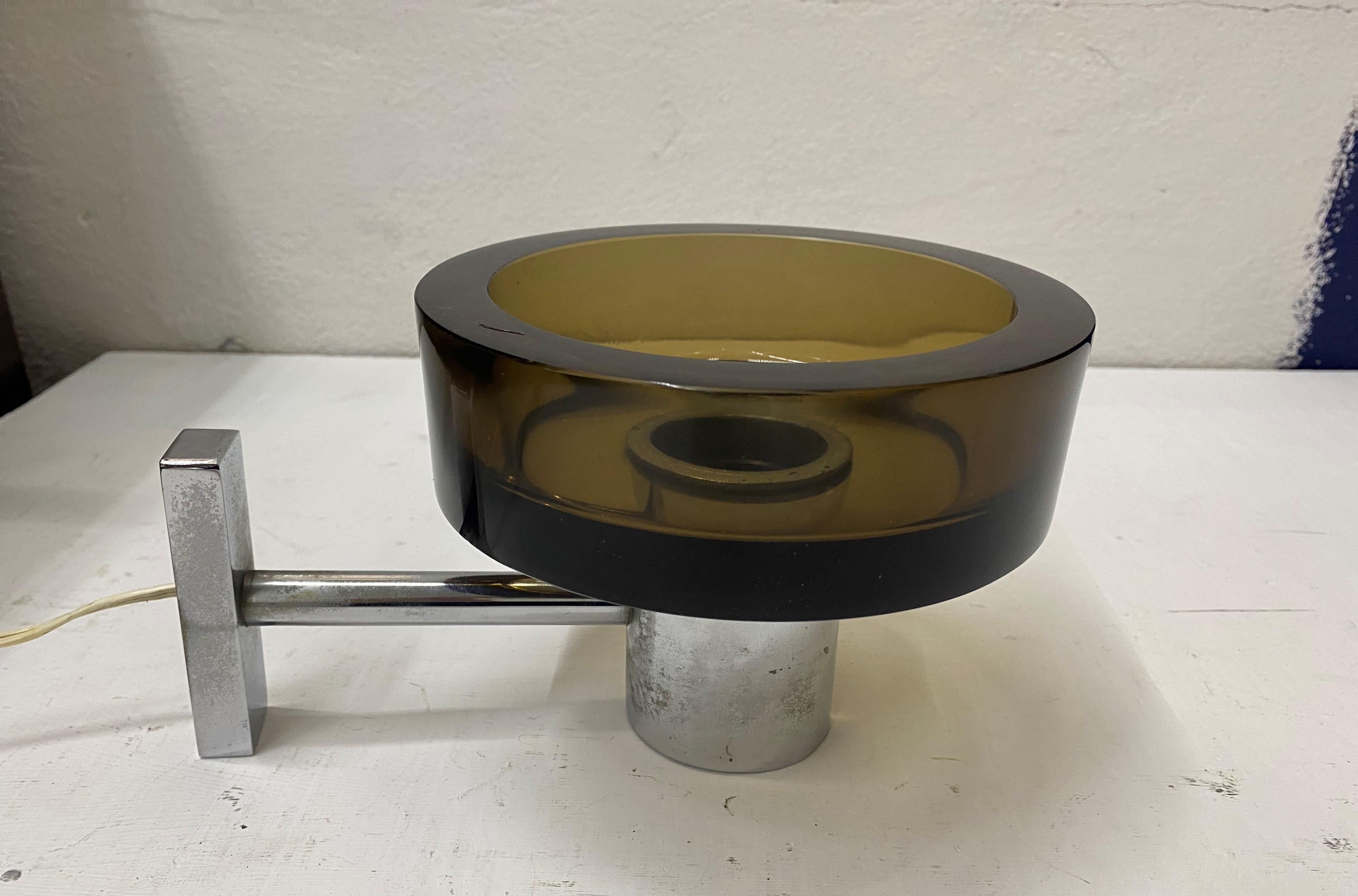 Mid-Century Modern wall lights designed by Flavio Poli and manufactured by the Seguso Factory in Murano, Italy, circa 1970.
Each sconce consists of a chromed metal base and a very heavy glass shade.
There are 4 available in brown glassand we have