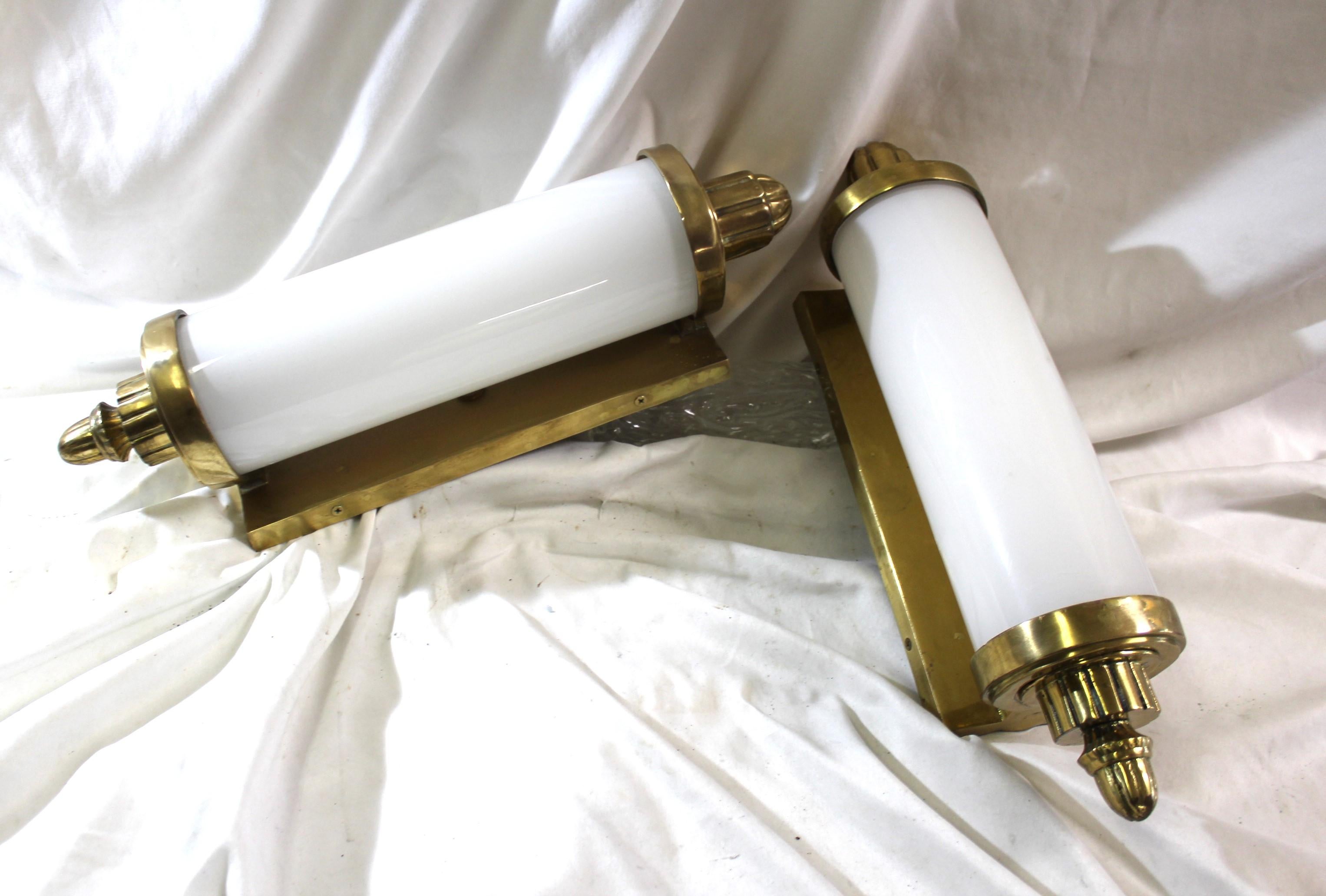A real find of a sconce . Made after the Original one's found in a Hi-School in Oregon . Solid ,heavy brass castings polished .  The glass Cylinder has a white defuse paper rolled up inside for soft light . See photo details .  No maker marks found