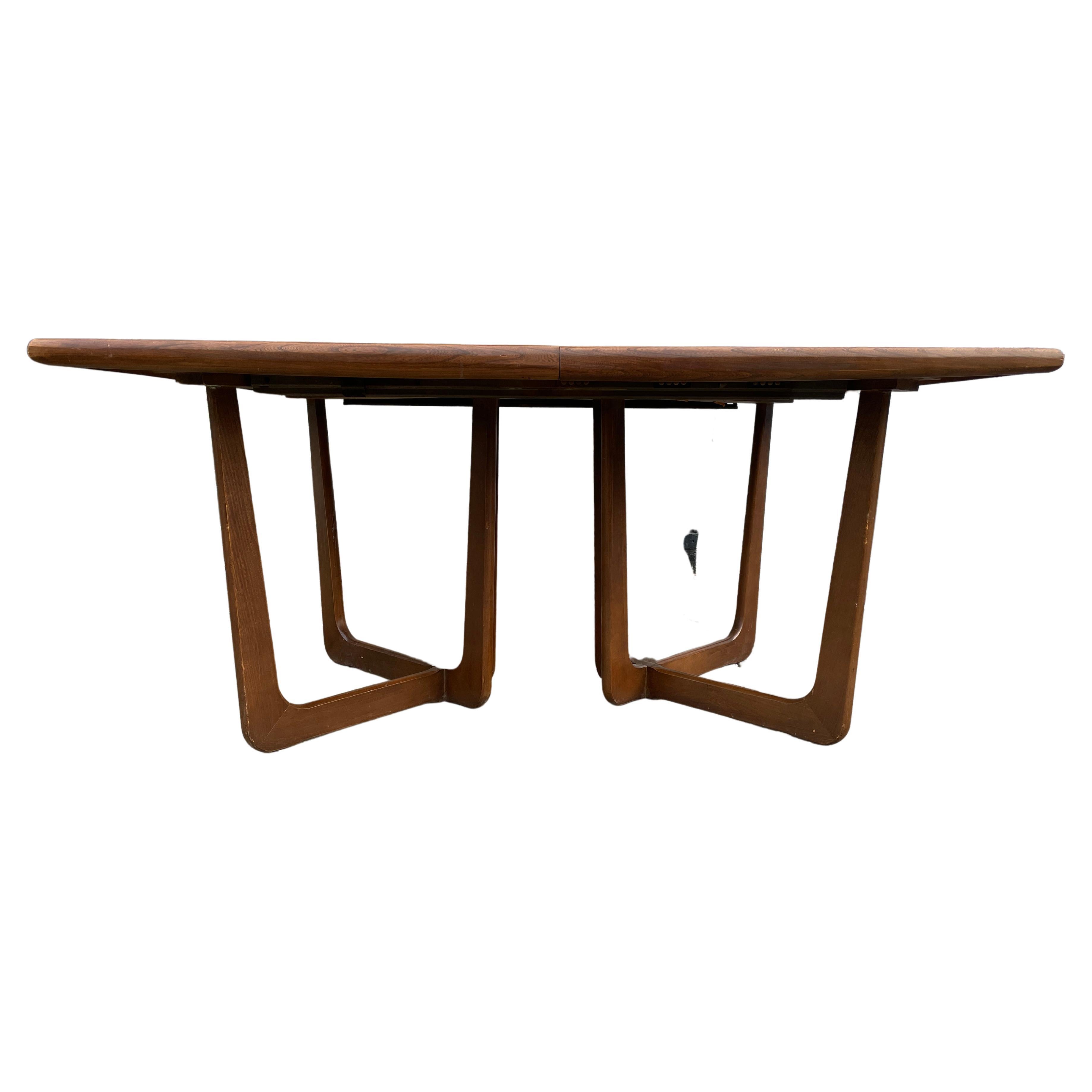 Mid-Century Modern Sculpted base walnut dining table style of Adrian Pearsall - Good Vintage condition - shows signs of use and wear - no major damage - 2 out of the 3 leaves are darker in finish due to Low use - 1 leaf matched perfectly. Located in