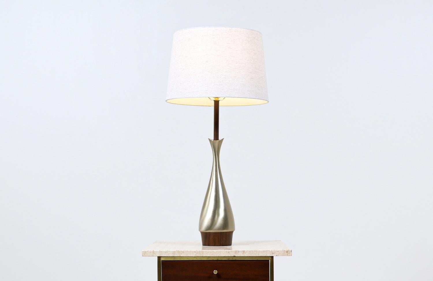 Dimensions:

31in H x 5in W x 5in D
Lamp Shade: 10in H x 13in - 15in W.

________________________________________

Transforming a piece of Mid-Century Modern furniture is like bringing history back to life, and we take this journey with passion and