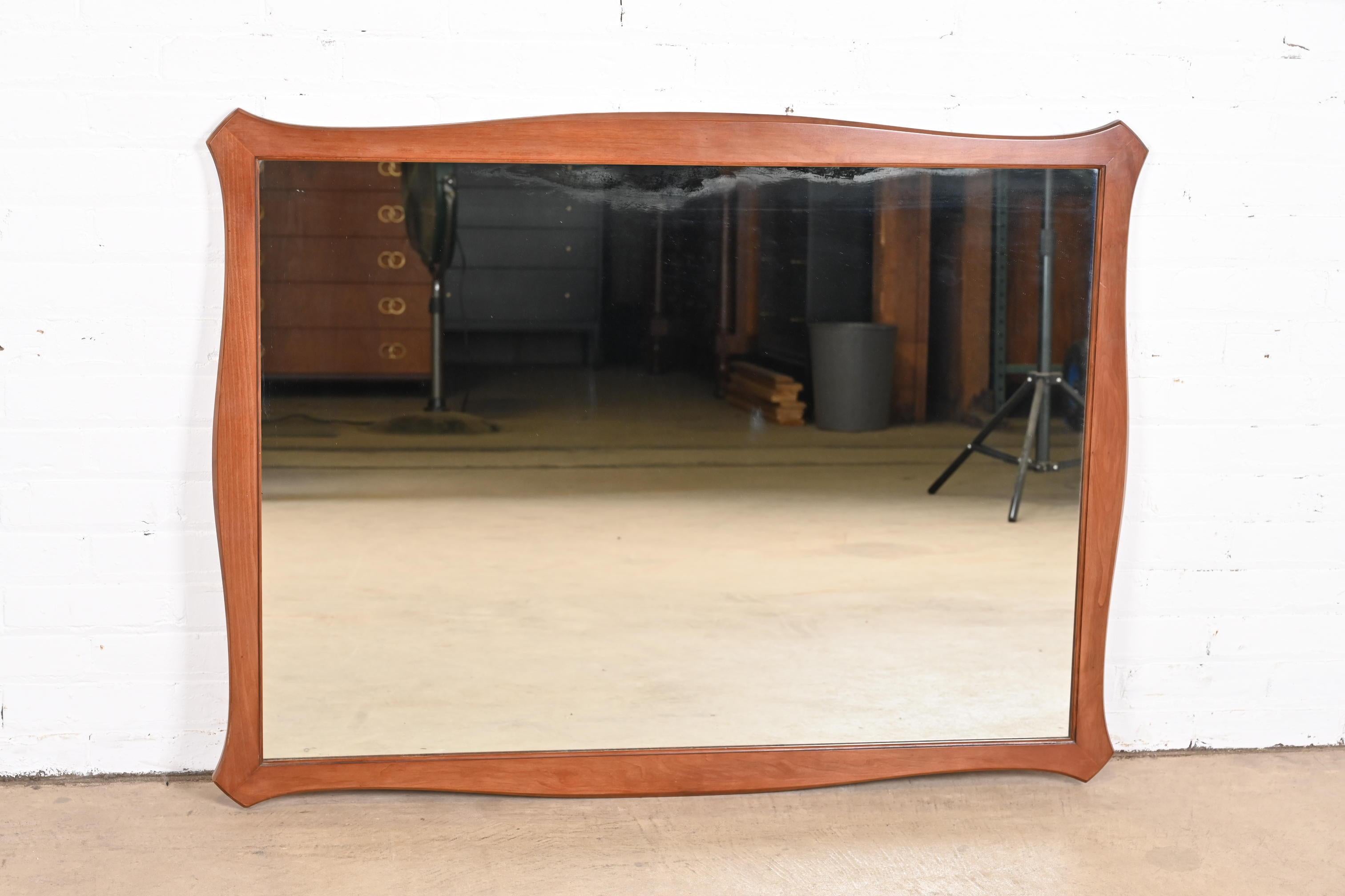 American Mid-Century Modern Sculpted Cherry Wood Framed Wall Mirror