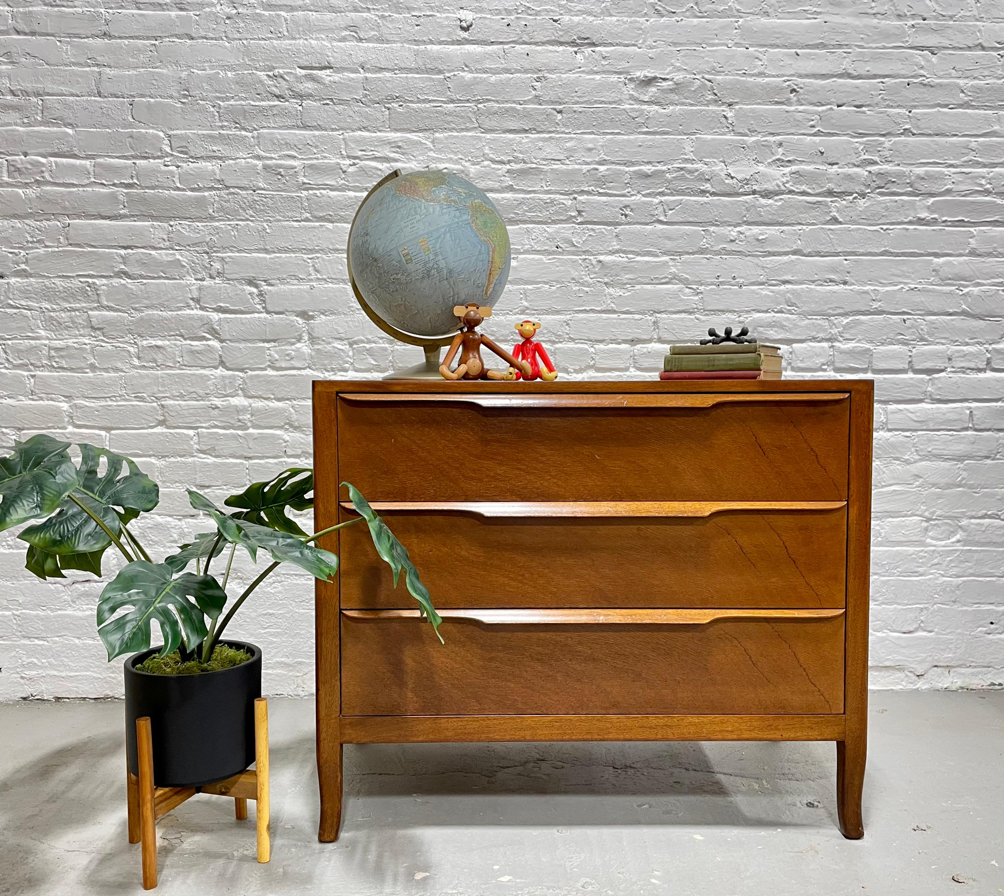 Mid-Century Modern Sculpted Drawer Walnut dresser by Sligh Furniture Company. The structure and quality of this piece highlight the elegant Mid Century style construction. The three deep and spacious drawers are perfect for clothing storage or as an