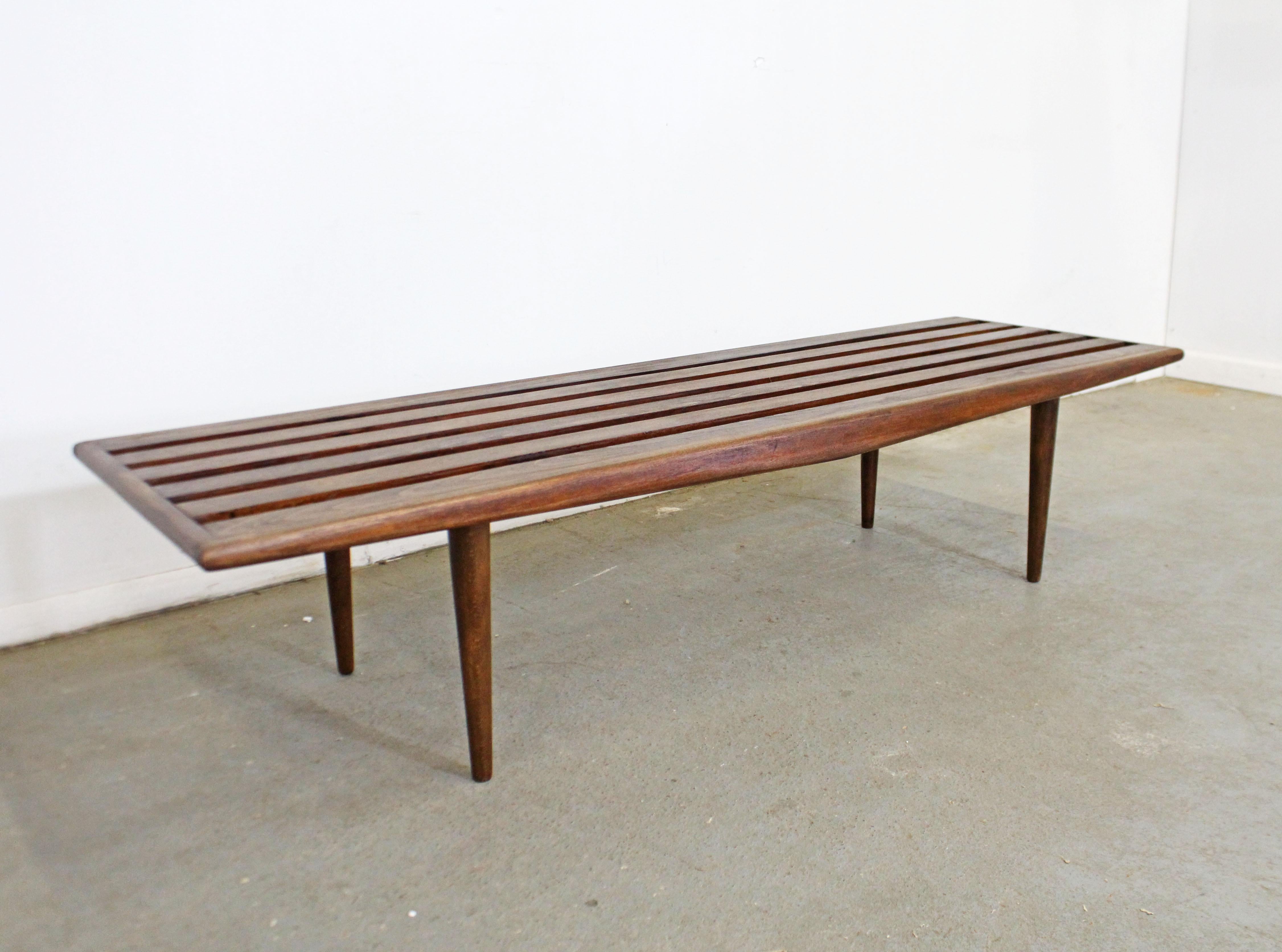 What a find. Offered is a vintage Mid-Century Modern walnut slat bench coffee table. It has a nice look with a sculpted top made of wood slats. Has been refinished and is in good condition with minor surface wear. It is structurally sound and