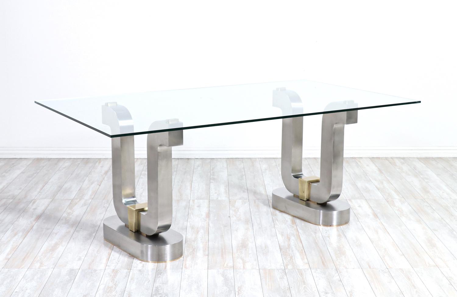 Mid-Century Modern sculpted metal dining table with glass top.

________________________________________

Transforming a piece of Mid-Century Modern furniture is like bringing history back to life, and we take this journey with passion and