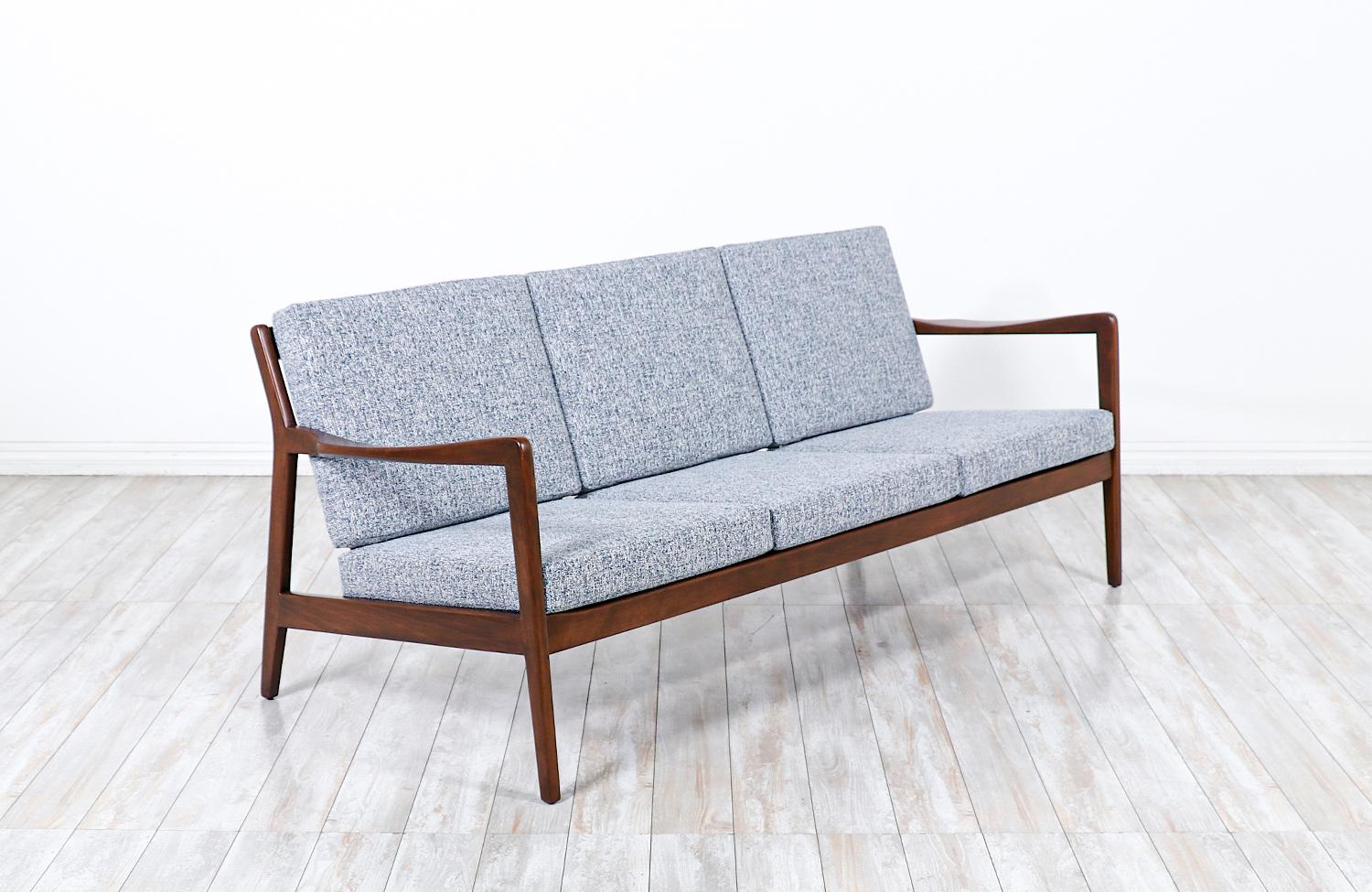 Mid-Century Modern sculpted sofa by Folke Ohlsson for Dux