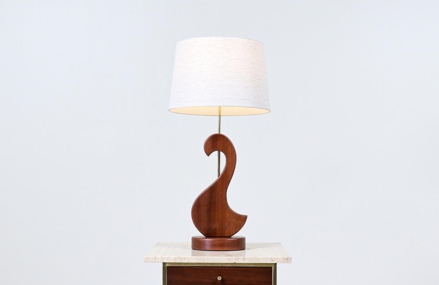 Mid-Century Modern sculpted teak swan style table lamp.

________________________________________

Transforming a piece of Mid-Century Modern furniture is like bringing history back to life, and we take this journey with passion and precision. With