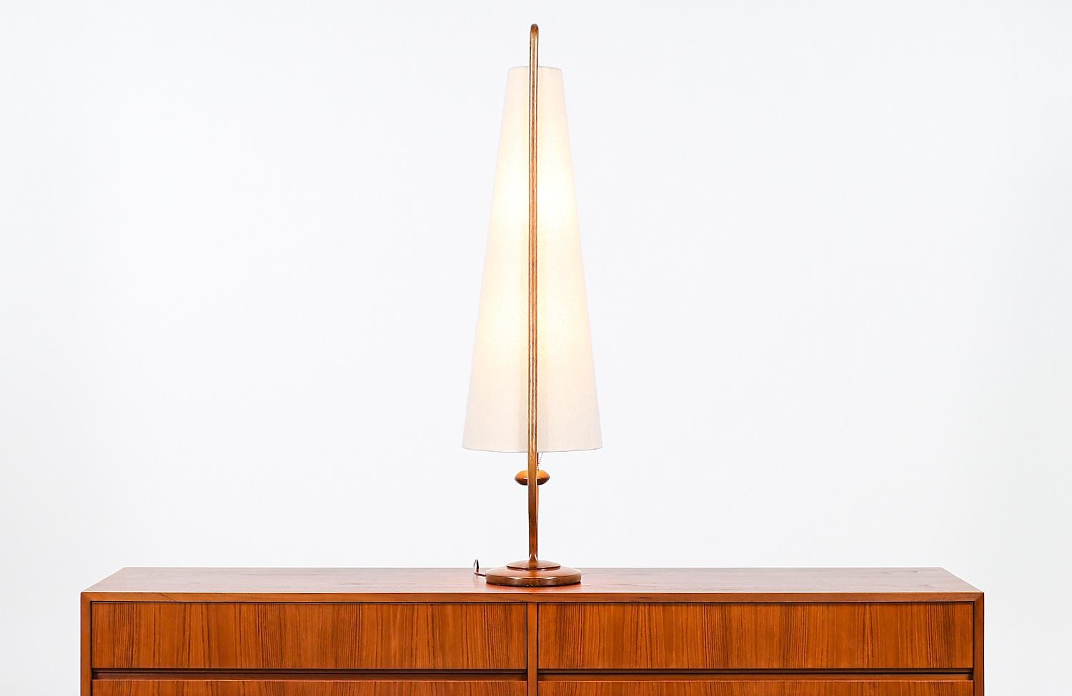Polished Mid-Century Modern Sculpted Walnut Arc and Brass Table Lamp by Modeline