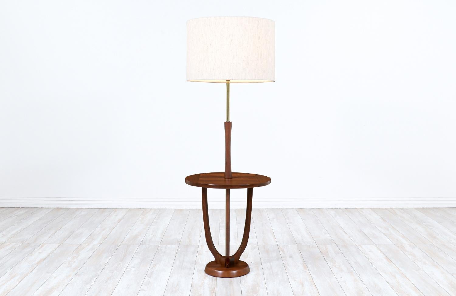 Dimensions
53 in H x 18 in W x 18 in D
Lamp shade: 12 in H x 18 in W
Table Height: 20.25 in.
 
________________________________________

Transforming a piece of Mid-Century Modern furniture is like bringing history back to life, and we take this