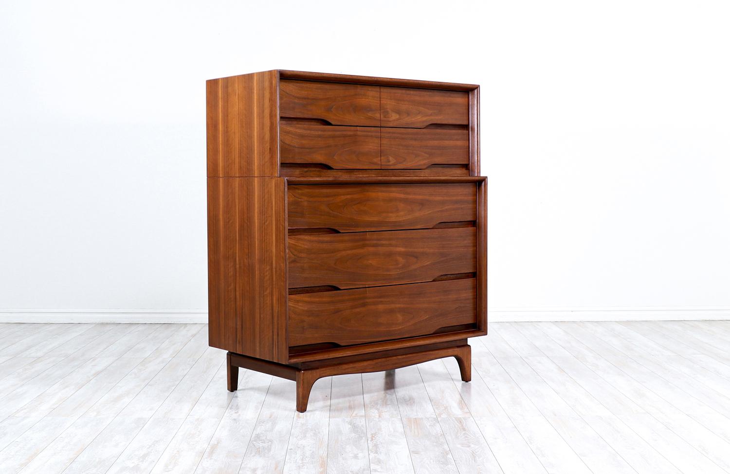 Mid-Century Modern sculpted walnut chest of drawers.