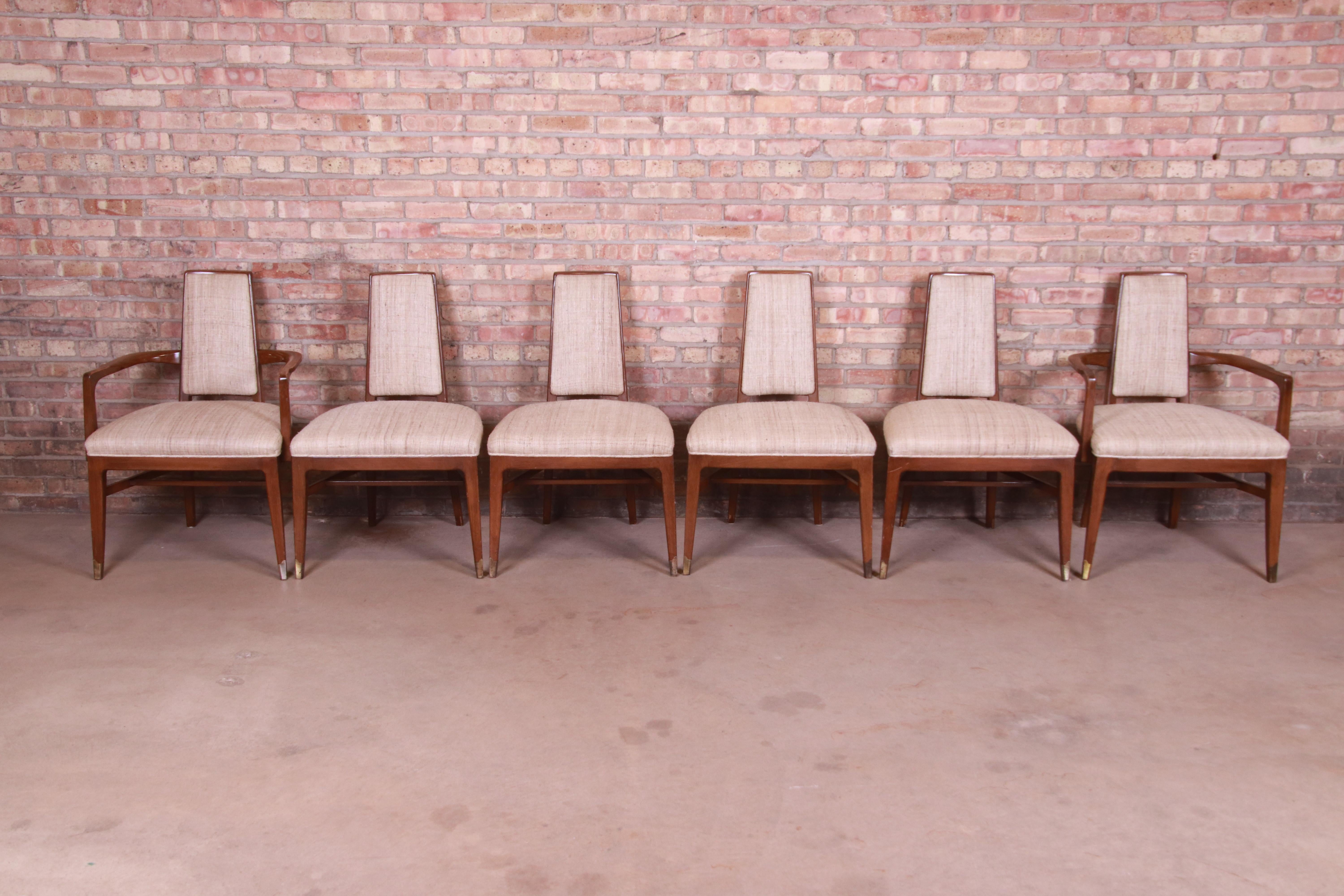 A gorgeous set of six Mid-Century Modern dining chairs

By White Furniture

USA, circa 1960s

Sculpted walnut frames, with upholstered seats and backs.

Measures:
Armchairs 24