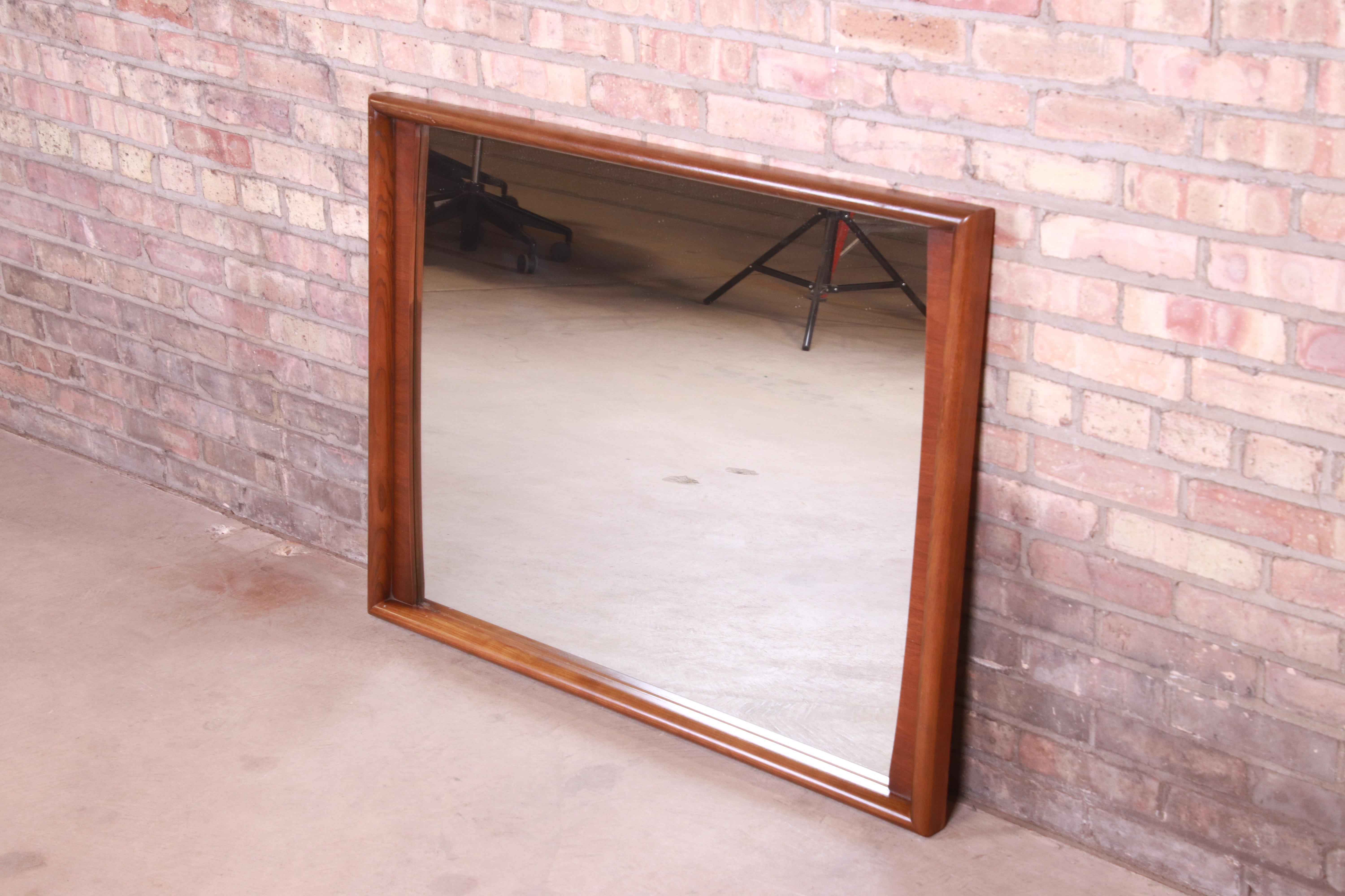 American Mid-Century Modern Sculpted Walnut Framed Wall Mirror by United, 1960s