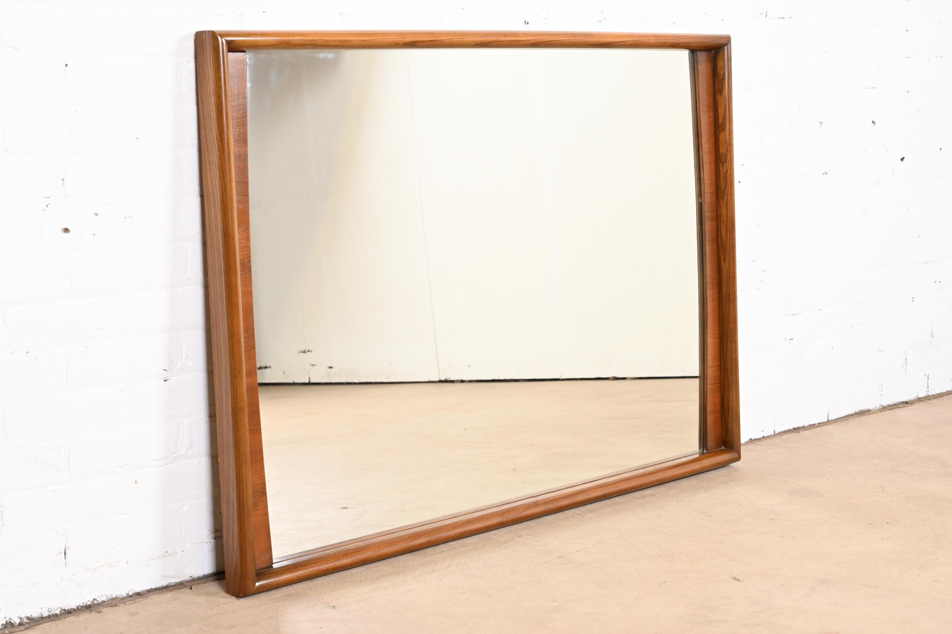 American Mid-Century Modern Sculpted Walnut Framed Wall Mirror by United, 1960s
