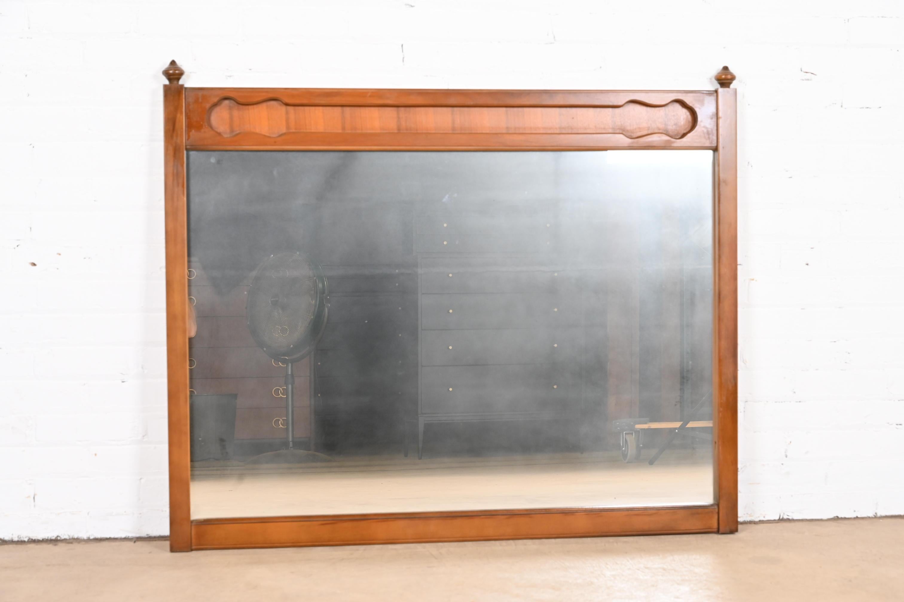 American Mid-Century Modern Sculpted Walnut Framed Wall Mirror For Sale