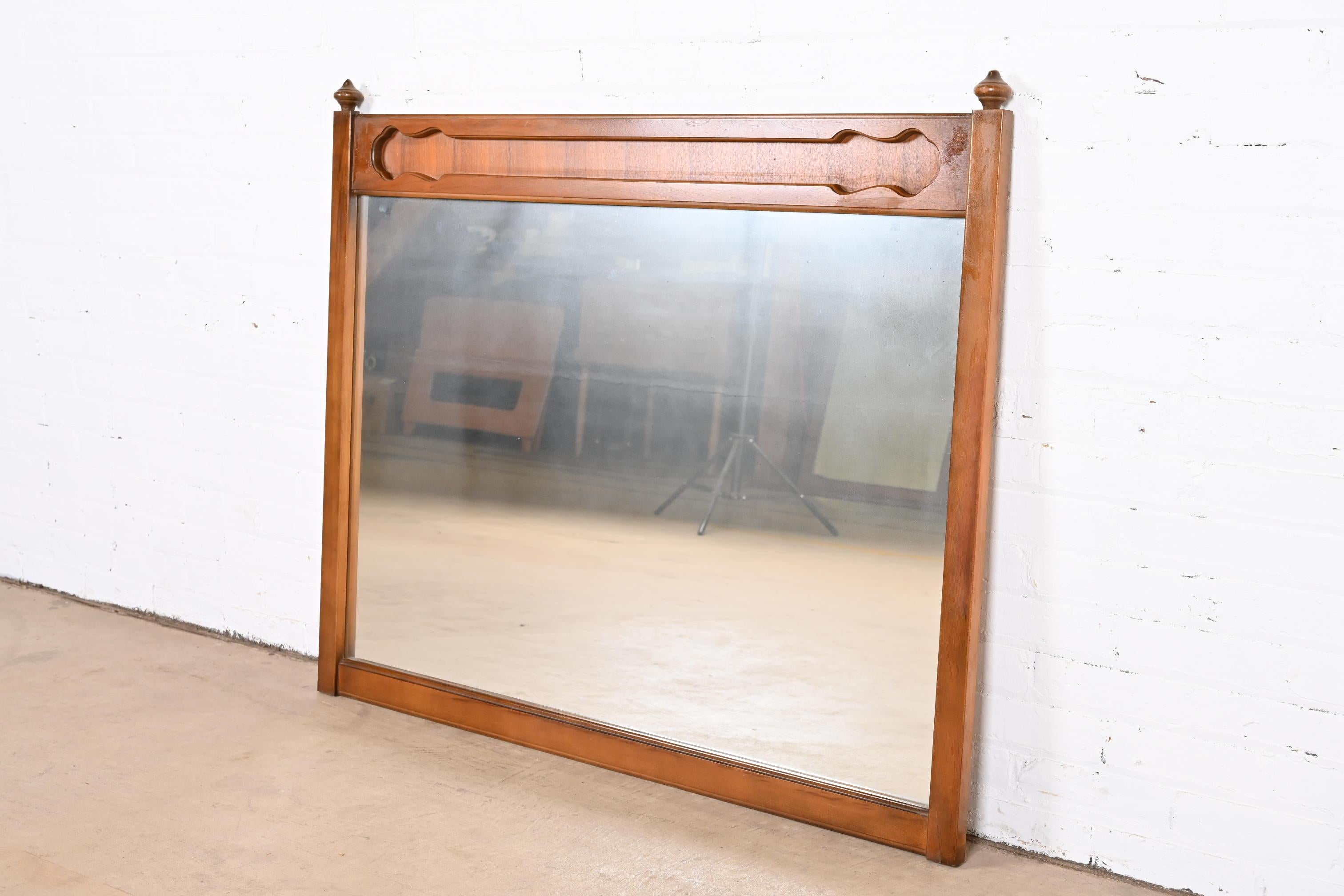 Mid-20th Century Mid-Century Modern Sculpted Walnut Framed Wall Mirror For Sale