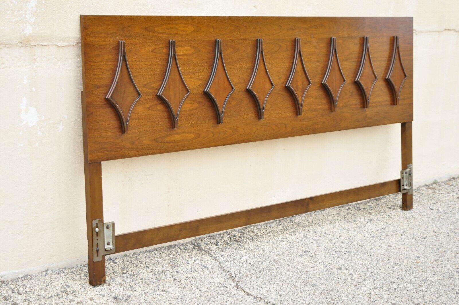 Mid-Century Modern Sculpted Walnut king size headboard by Hanover Made Furniture. Item features beautiful wood grain, original stamp, clean modernist lines, sleek sculptural form. Circa Mid 20th Century. Measurements: 40