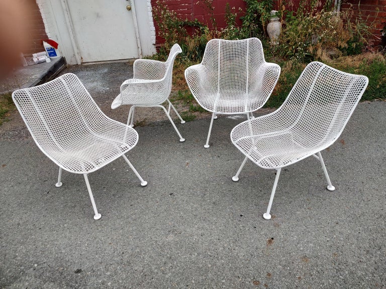 Fabulous set of 4 original Sculptura chairs, 2 arm, 2 side in white paint. Molded mesh which conforms to the body. In excellent vintage condition with minimal wear and lots of coatings for protection. Recently sprayed. Priced and sold as a set of 4.