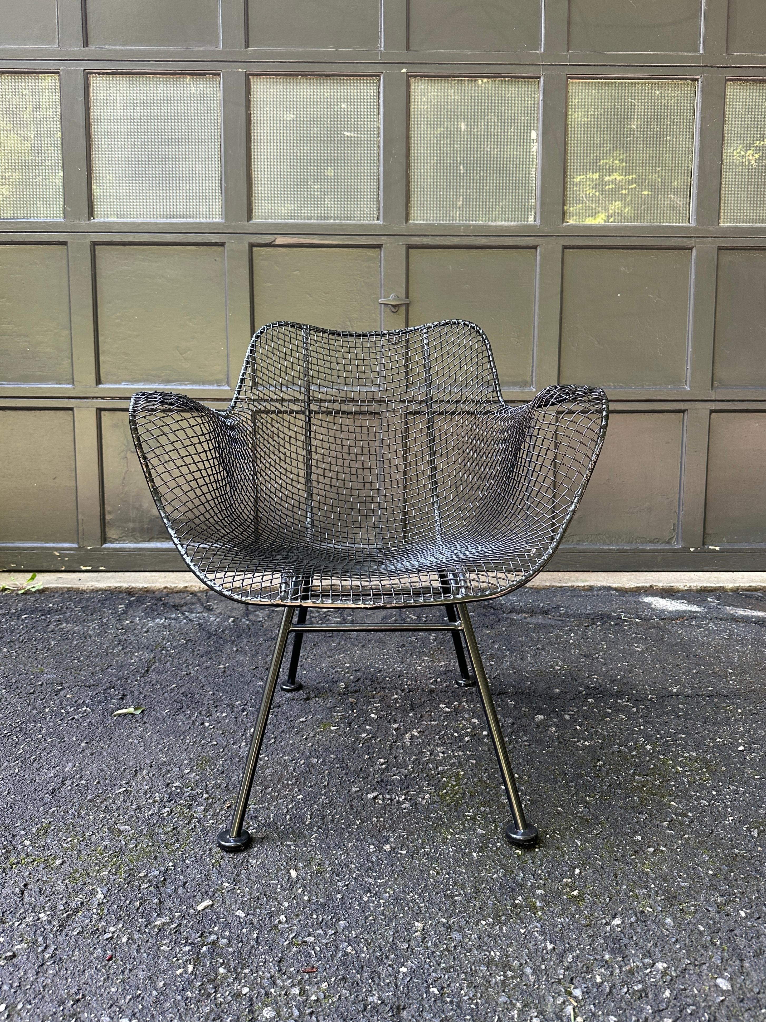 1950s Russell Woodard Sculptura set in black. No bends or breaks in the wire mesh. For indoor or outdoor use.

Measurements are slightly different

2 chairs 27ʺW × 22ʺD × 32ʺH x 16.5” Seat H x 26”Arm H

2 chairs 26”W x 23”D x 29.5”H x 16.6” SH x