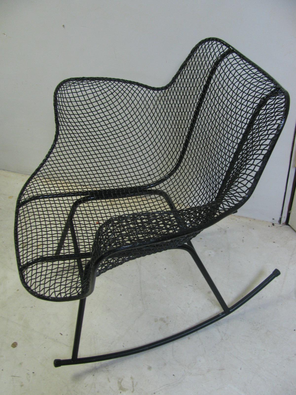 Fabulous example of Mid-Century Modern in a outdoor patio rocking chair. In excellent condition, freshly sprayed black.