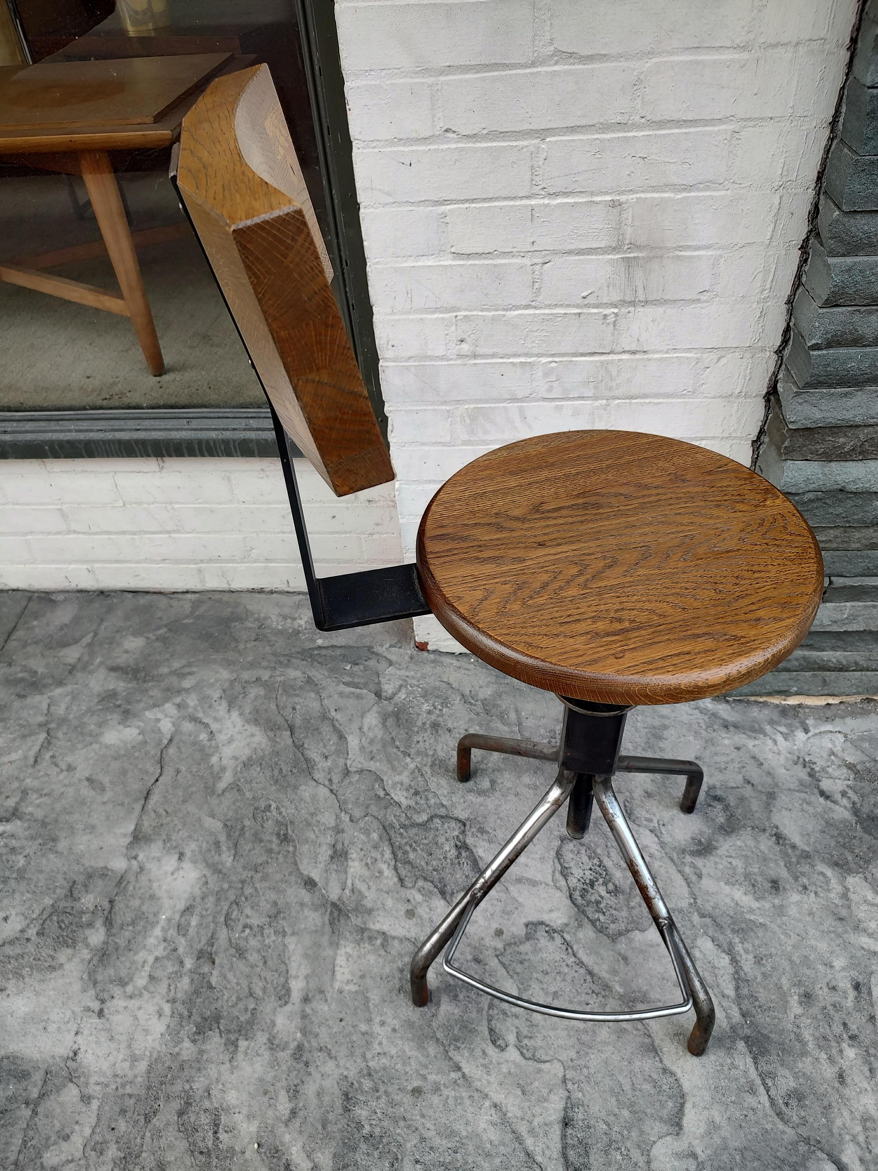 Fabulous adjustable custom made stool for a drafting table or work table. Adjusts in height from 25 to about 33. In excellent vintage condition with minimal wear. Oak seat and back which flexes. Chair can be parcel posted.
