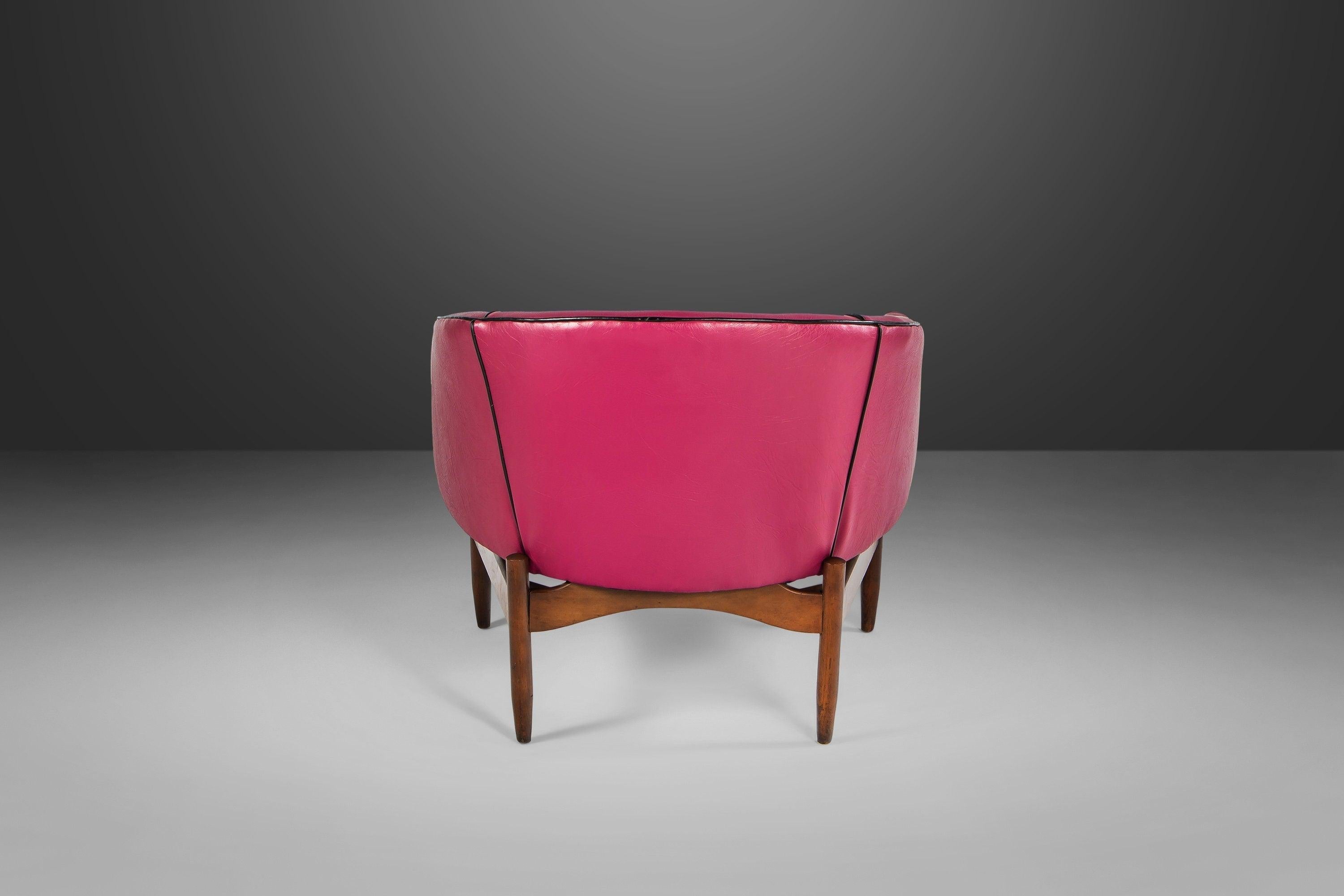 An iconic design by Lawrence Peabody. The chair is found in pink vinyl with contrasting black well cord and back buttons. If the upholstery isn't to your taste or if you have a different vision for your project, we are happy to assist you with