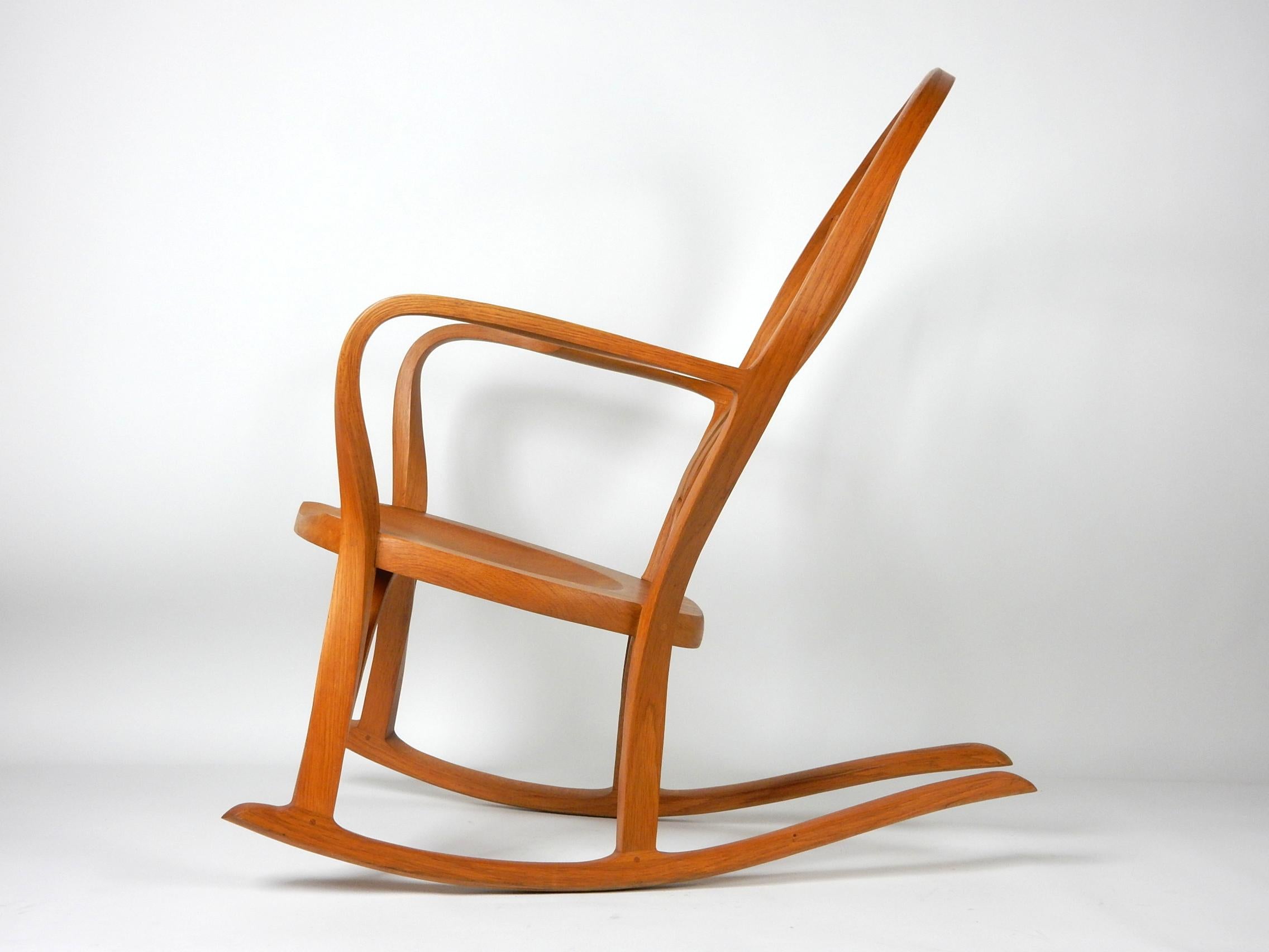 Sculptural rocking chair in the Sam Maloof style, circa 1970s
Not marked or signed however you can tell it was created
by a master carpenter.
Made of bent white oak with pegged joints. Solid and
extremely comfortable piece of functional art!
No