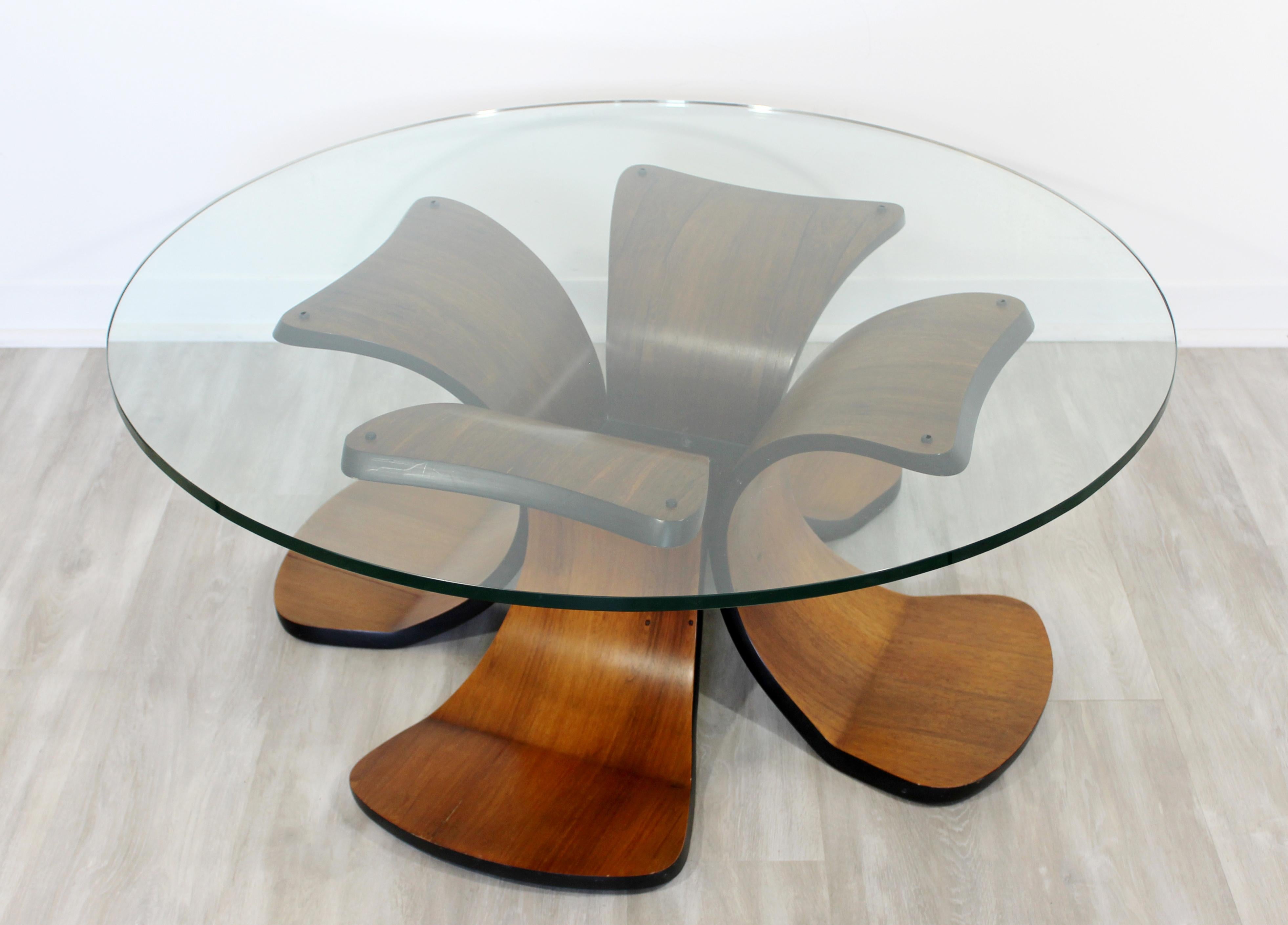 For your consideration is a phenomenal, rosewood and walnut coffee table with a round glass top, circa 1960s. In very good vintage condition. The dimensions are 42
