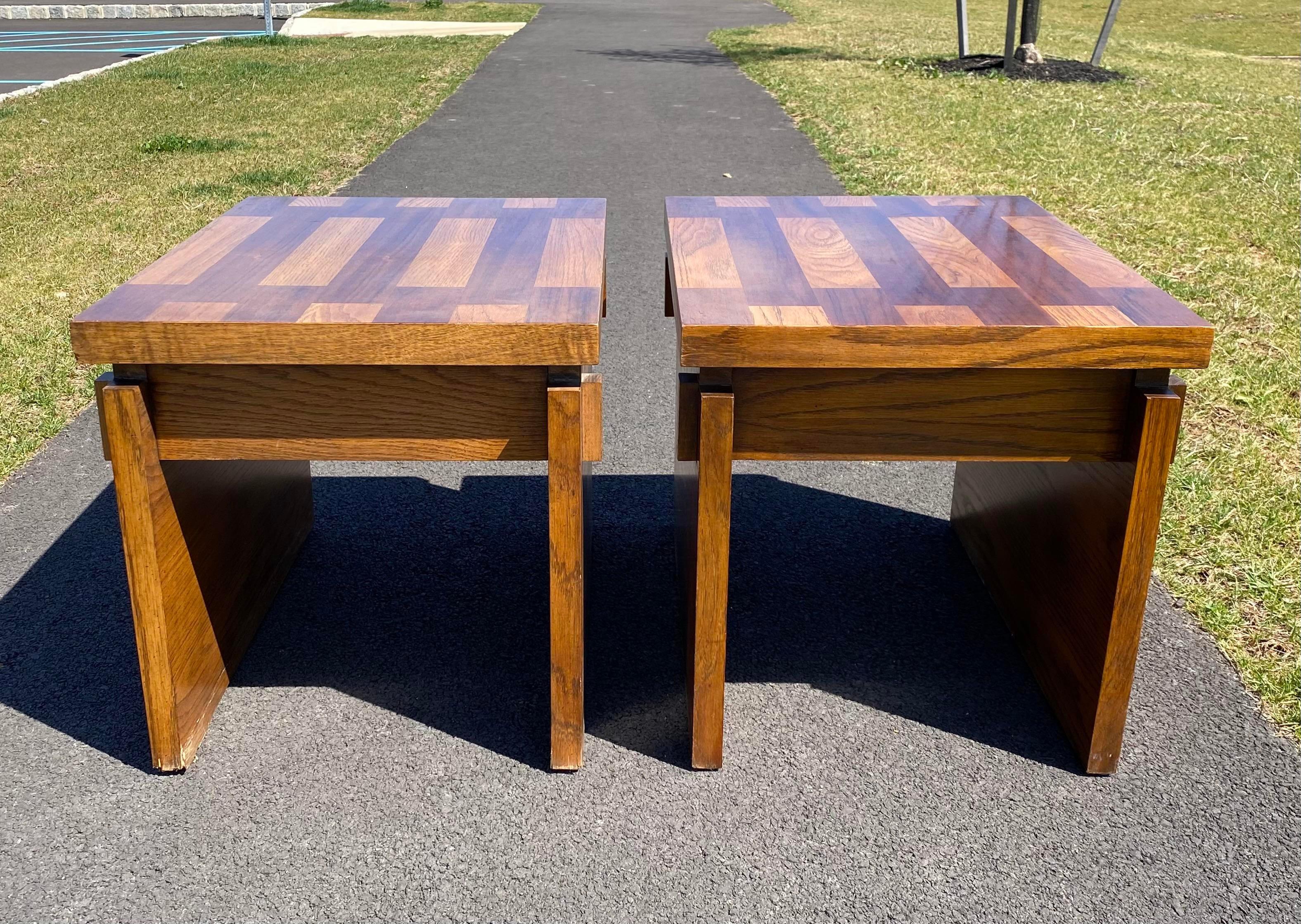 Pair of Mid-Century Modern sculptural wood block side or end side tables. Features parquet style table tops and chunky wood sides with decorative exposed mortise and tenon joinery. 

Lane Furniture, marked to underside. 
Circa 1970s.


