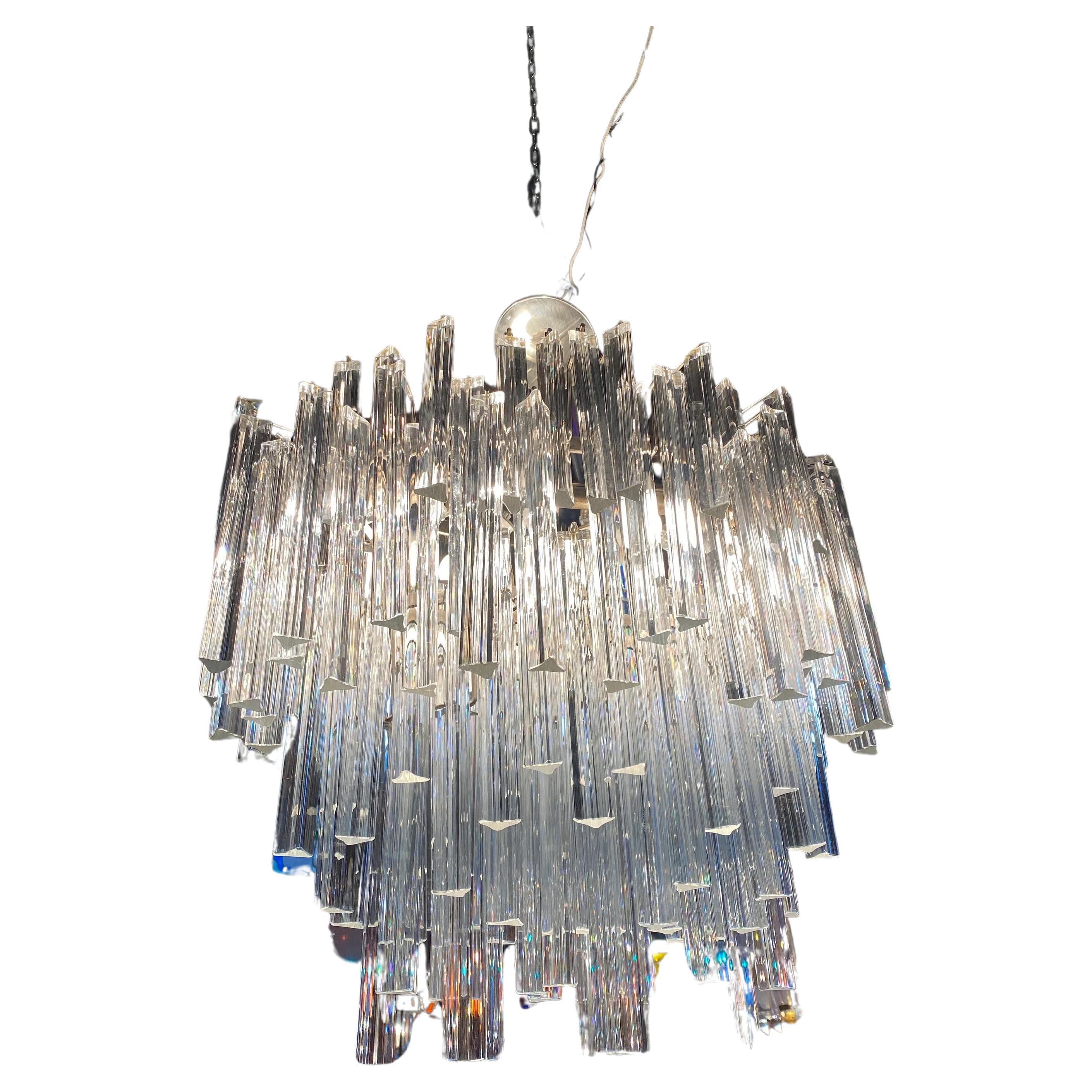 Mid Century Modern Sculptural Camer Murano Glass Multi Tier Prism Chandelier

A magnificent Murano glass chandelier made by Camer. Comprised of individually handblown Murano glass triangular crystal Triedri prisms on a frame. An iconic and timeless
