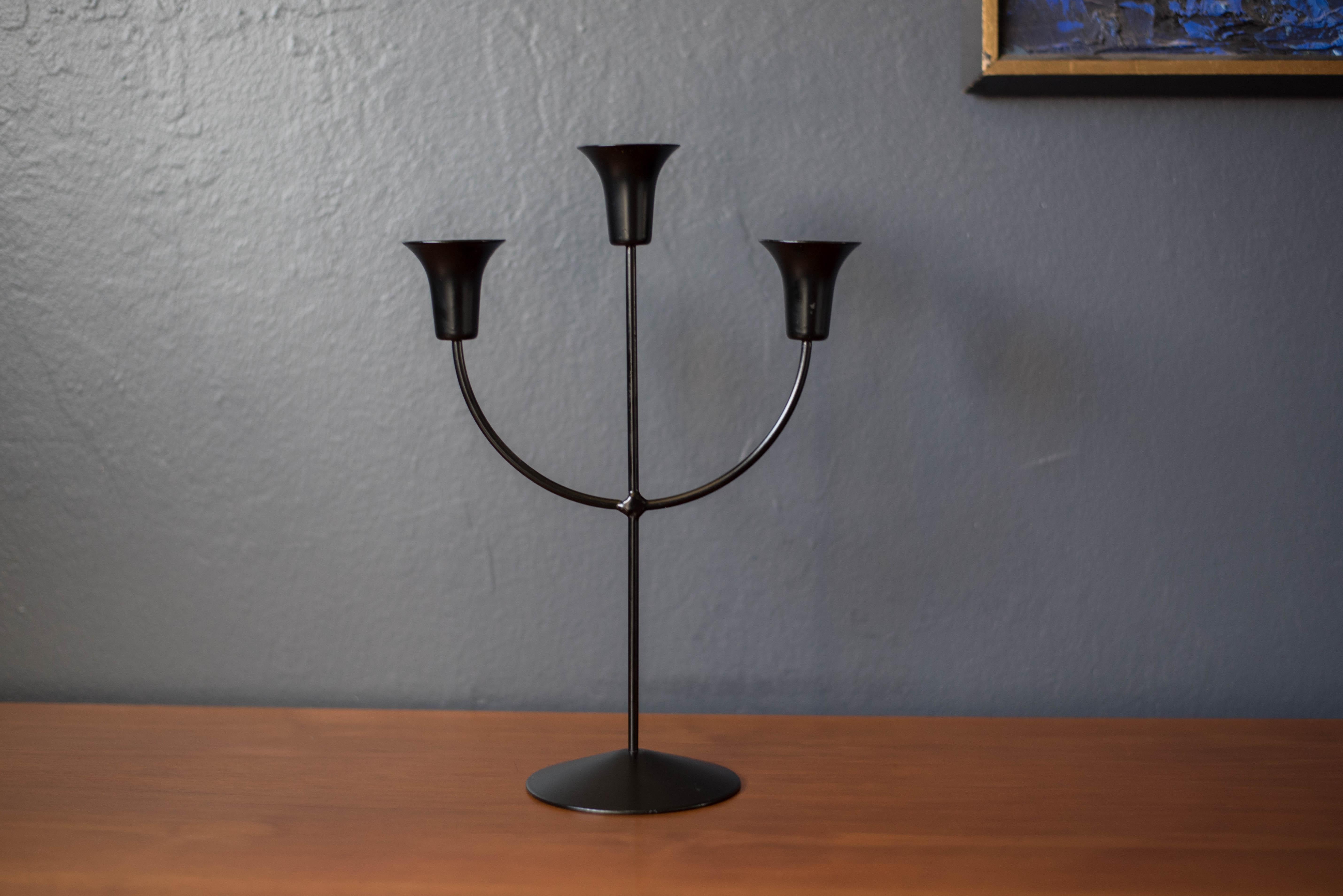 Vintage sculptural candelabra marked Boda Shop, Sweden, circa 1970s. This unique piece has a black metal finish and holds up to three taper candles. 

 