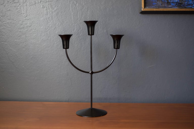 Vintage sculptural candelabra marked Boda Shop, Sweden, circa 1970s. This unique piece has a black metal finish and holds up to three taper candles. 

 