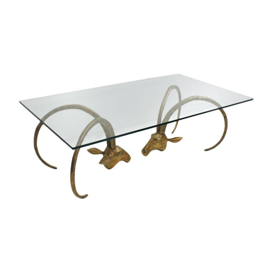Mid-Century Modern United States coffee table. Composed of two sculptures bronze heads of sheep shape base and rectangular beveled glass top. Made in EEUU 1940s. 

Our main target is customer satisfaction, so we include in the price for this item