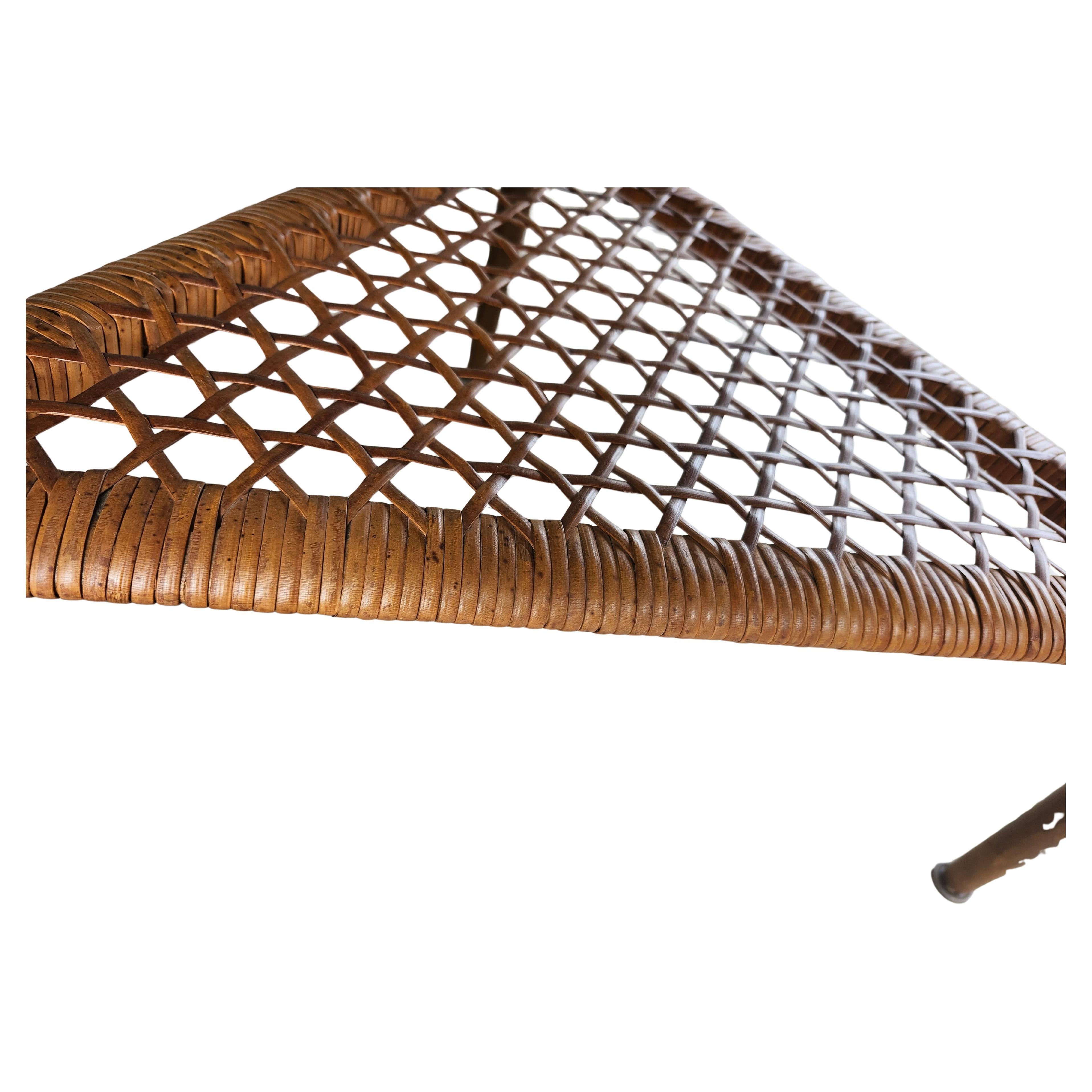 Simple and very elegant design by Poul Jensen with a guitar pick shape and a lip edge almost its entirety. Choice walnut veneers on top with a pattern. Caned shelf below is so beautiful and is excellent.  Top was refinished lightly. Overall in