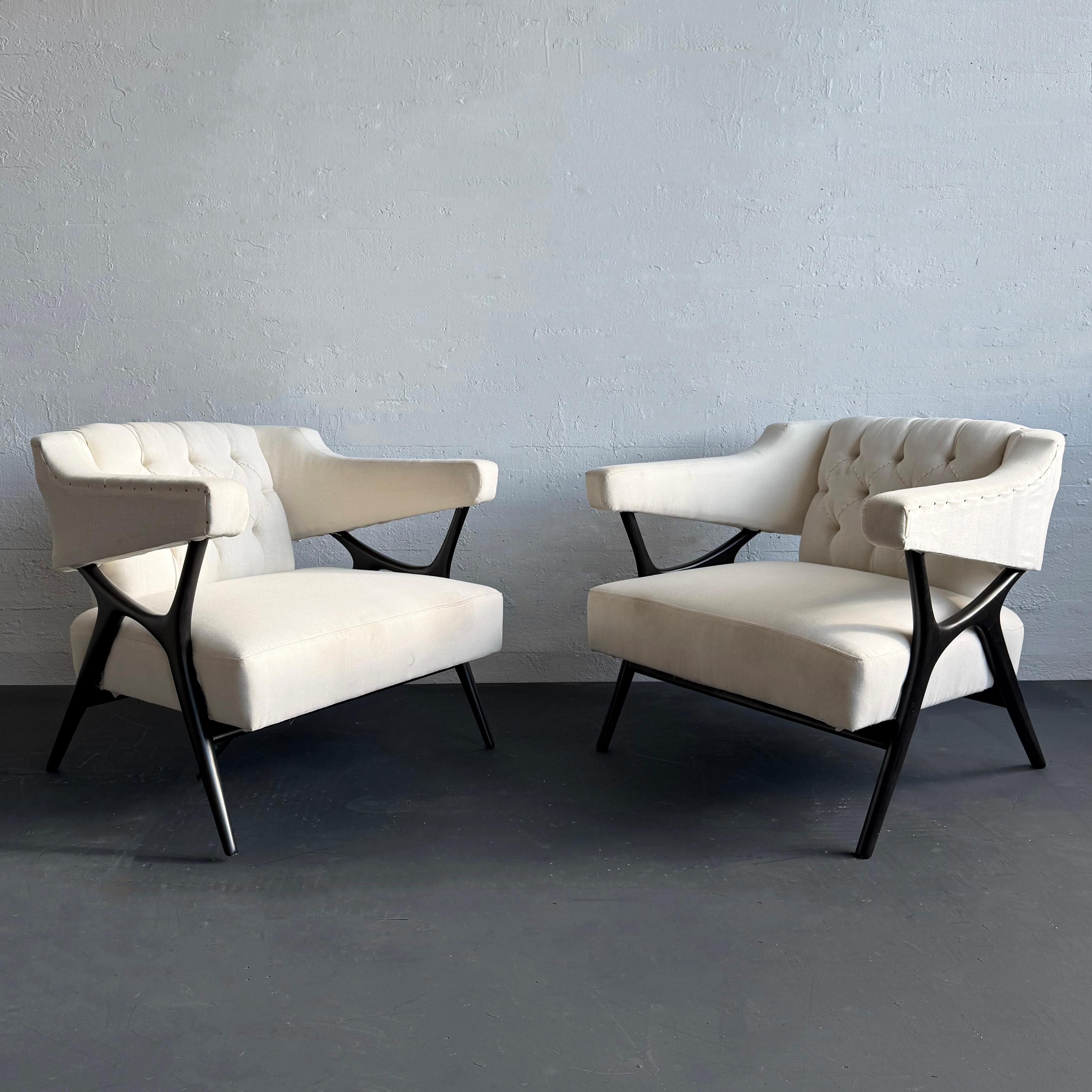 This pair of sculptural mid-century modern lounge armchairs designed by American designer/artist/sculptor Ward Bennett circa 1958 is truly dramatic seating. The chairs are fully upholstered with generous seats and tufted backs with outstretched arms