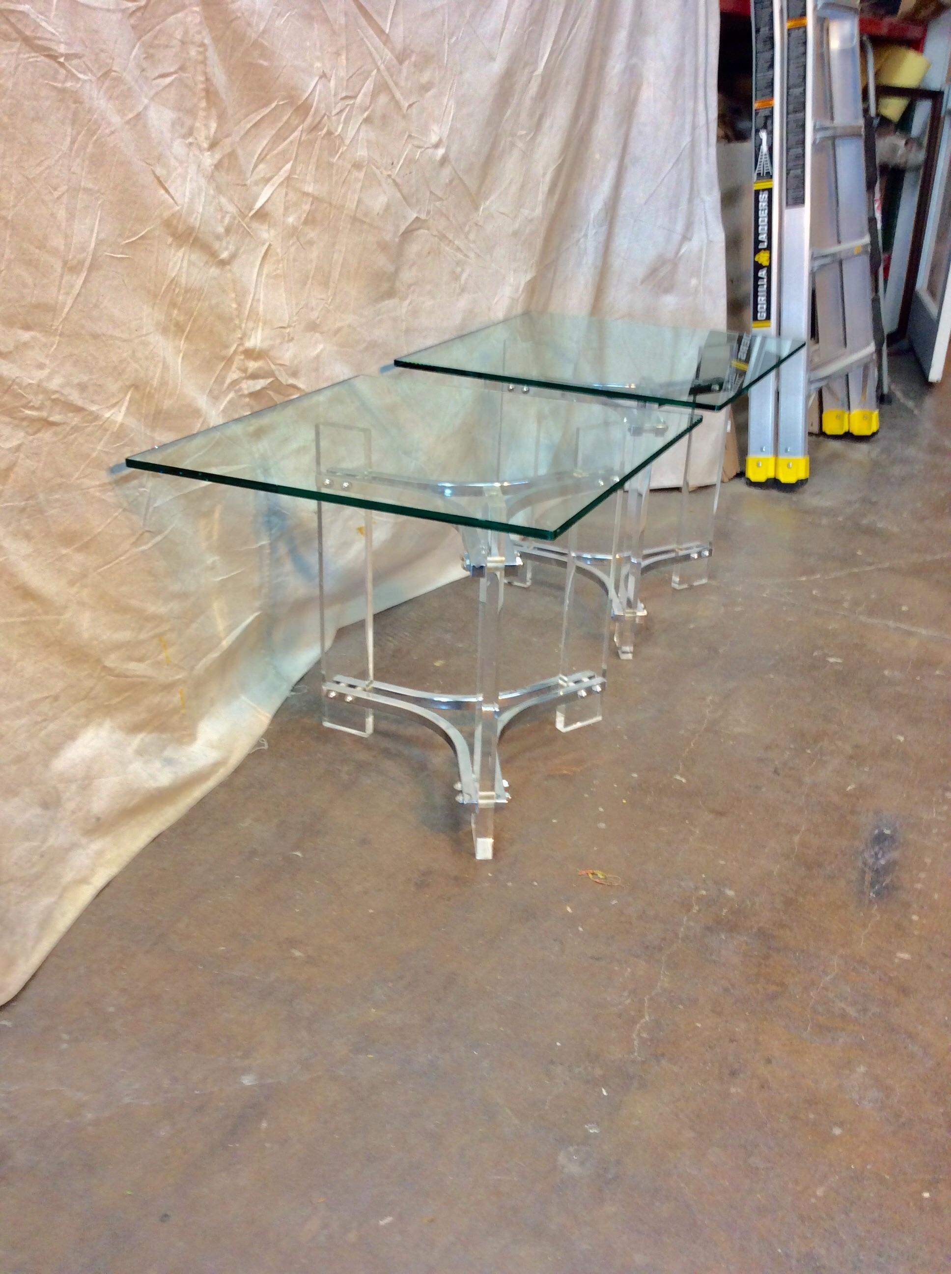 This pair of unique Vintage Mid-Century Modern Sculptural lucite Chrome and Glass Side Tables are attributed to American designer Charles Hollis Jones. In the Art Deco style, these tables feature a square 1/2