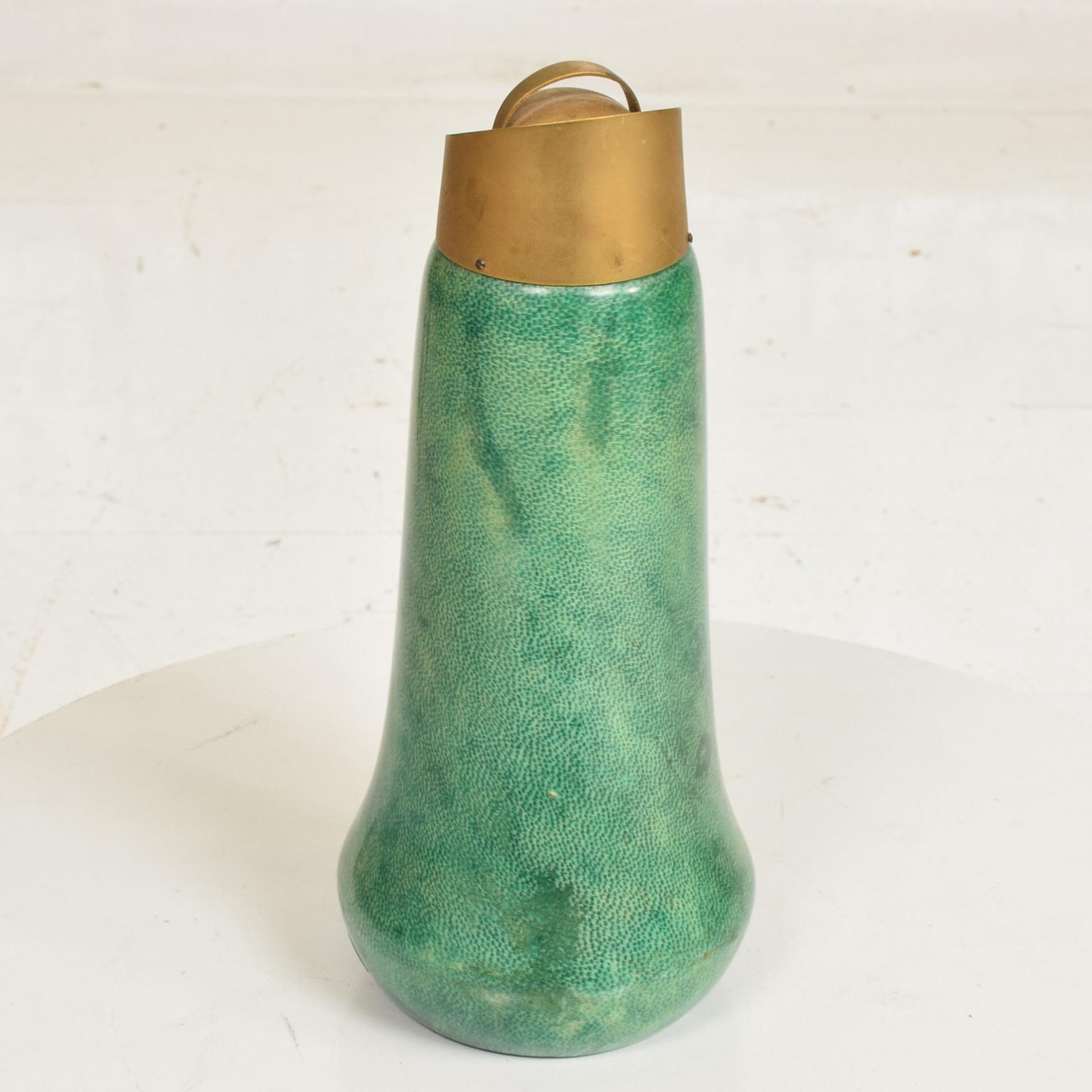 For your consideration, a beautiful Mid Century Modern Sculptural Pitcher by Aldo Tura in Green Goatskin and Brass Accents.
Unique shape with builtin handle. Retails original label in the lower part of the pitcher. 
Made in Italy, circa the 1960's.