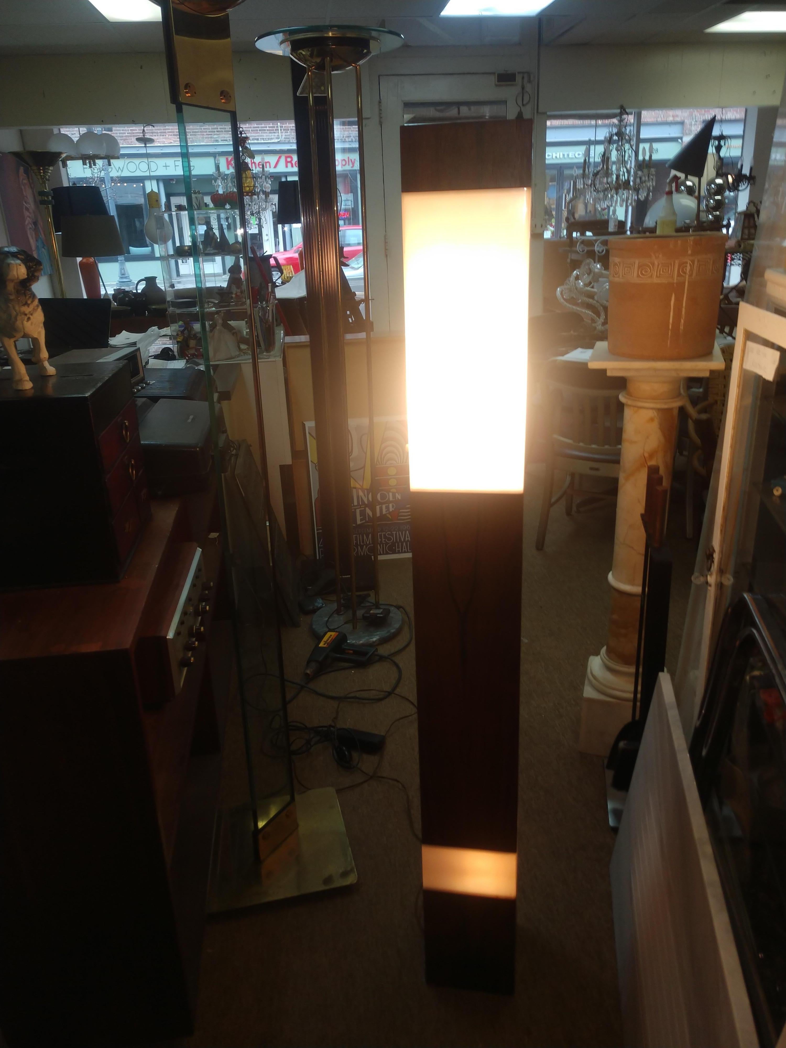 Simple and elegant tall statuesque tower floor lamp in Rosewood and plexiglass. Has two lights, main light is at the top and has a 3way switch while bottom light is more of a mood & novelty light.
In excellent vintage condition with minimal wear.