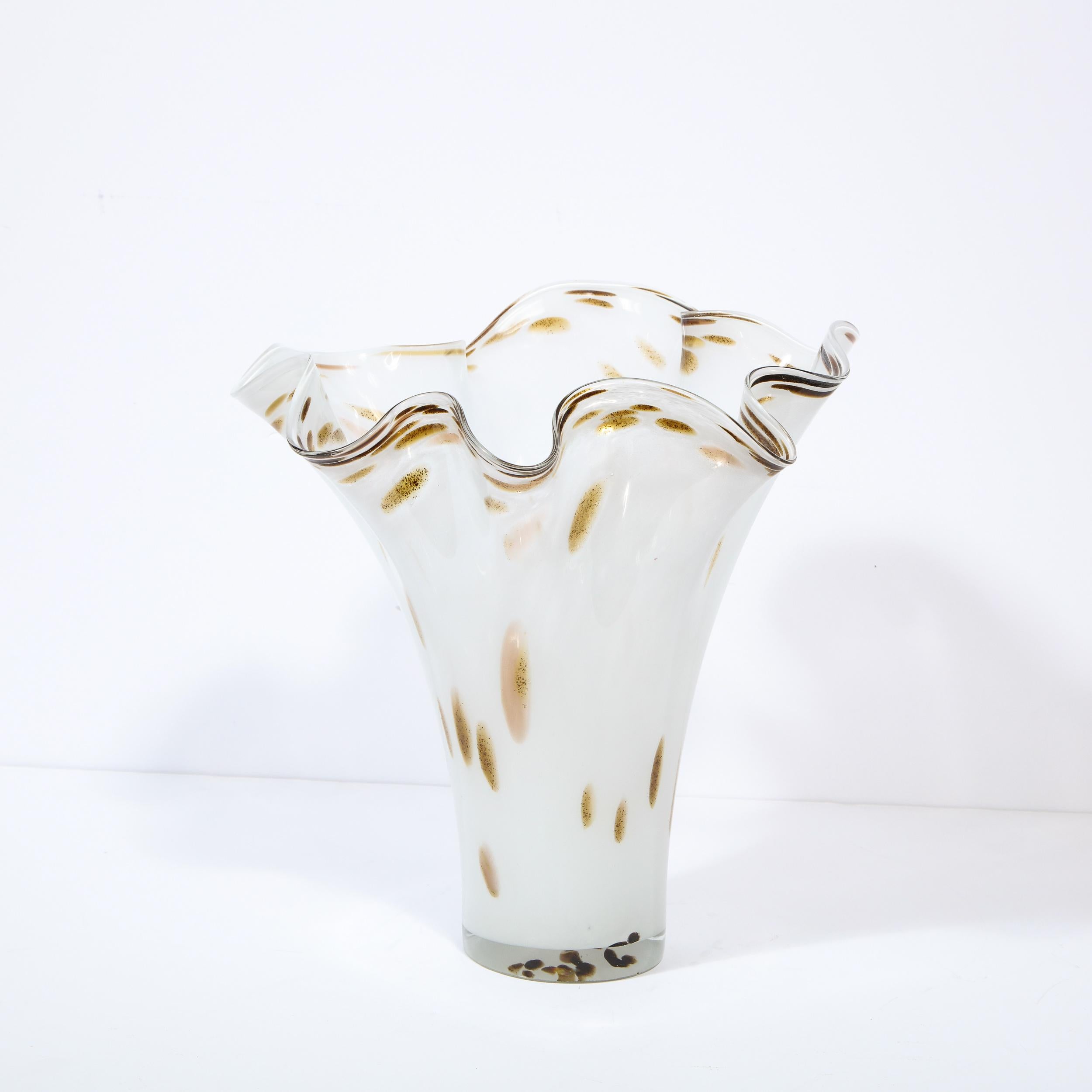 This stunning Mid-Century Modern vase was realized in Murano, Italy- the island off the coast of Venice renowned for centuries for its superlative glass production- circa 1960. It features a cylindrical body in white glass with java and cafe au lait