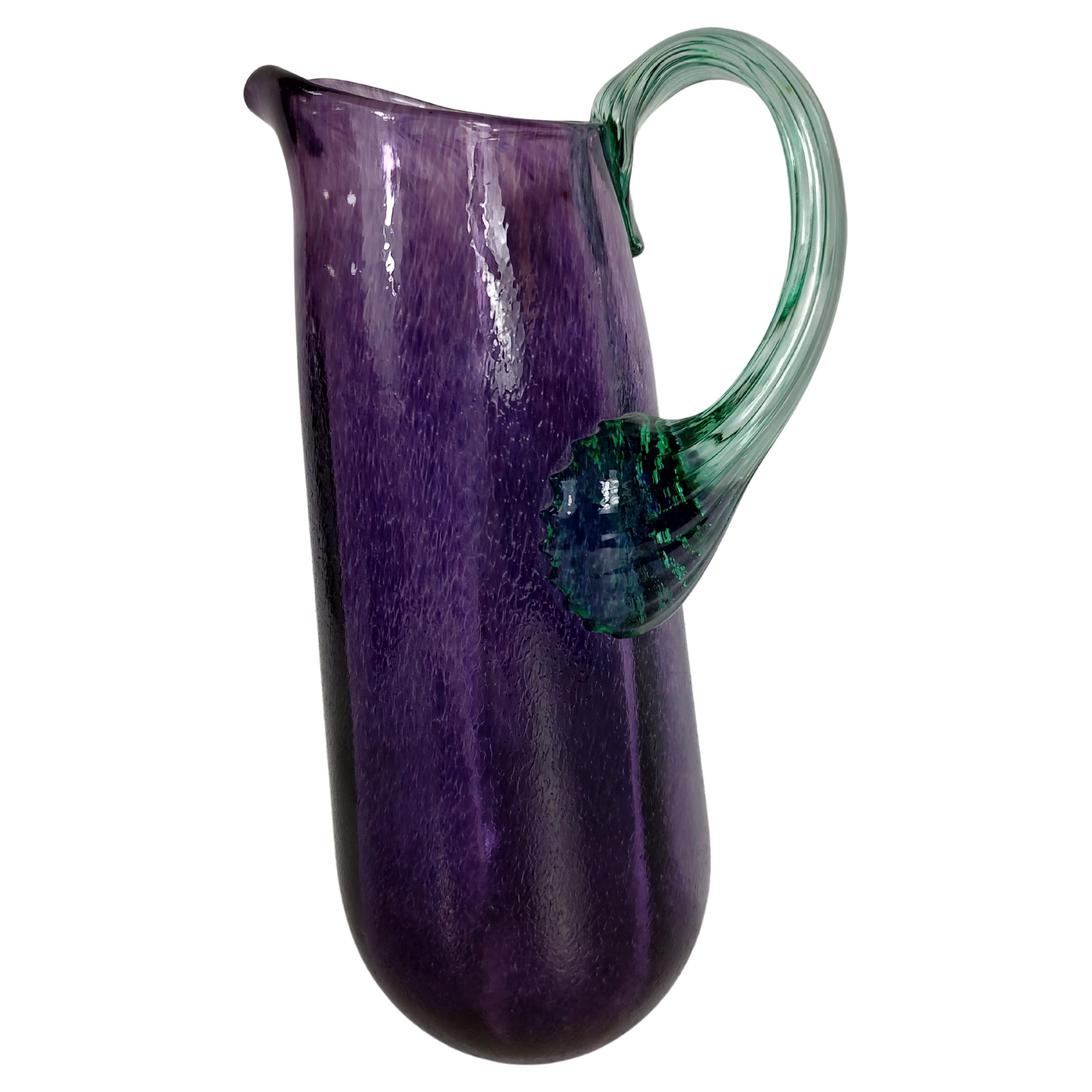 Fabulous colors with an applied handle, purple with green. In excellent condition with no issues. Signed by the artist and labeled.