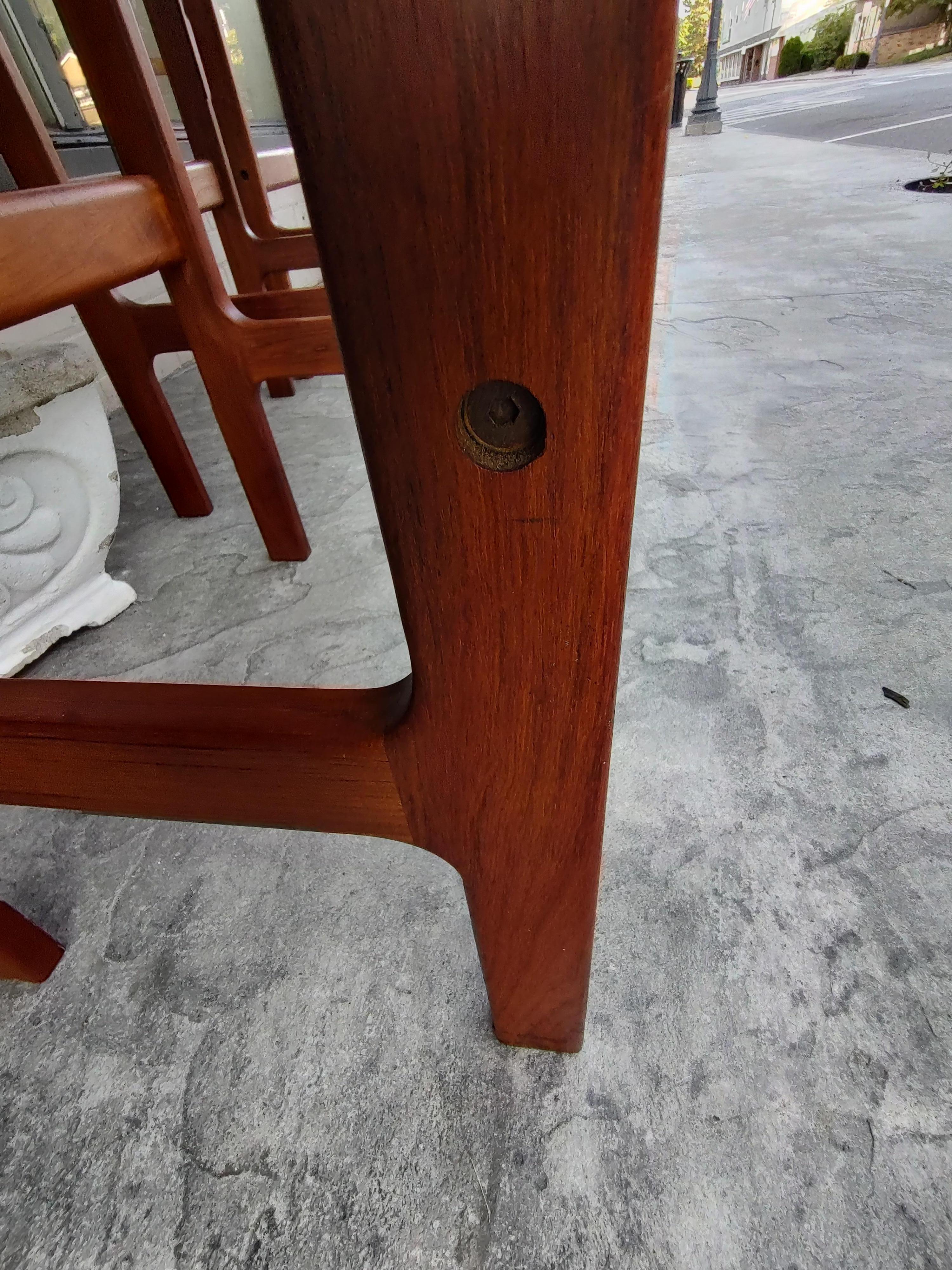 Fabulous set of 4 teak bar stools with arms and a back. Fabric is lightly soiled but in good condition. Frames are excellent. Sold and priced individually. Signed d- scan on underside of the seat.