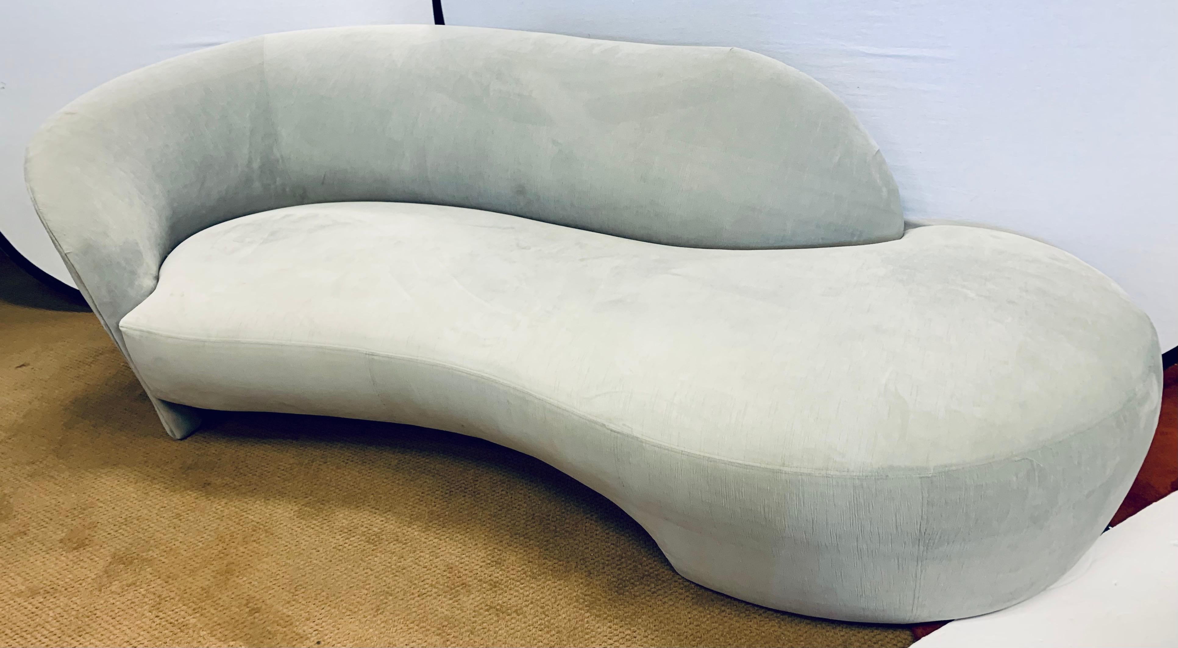 Stunning organic sculptural serpentine sofa after with great scale and lines to die for. The luxurious gray velvet fabric is less than two years old and is still in very good condition save for a spot or two - see pics. This sofa will be the most