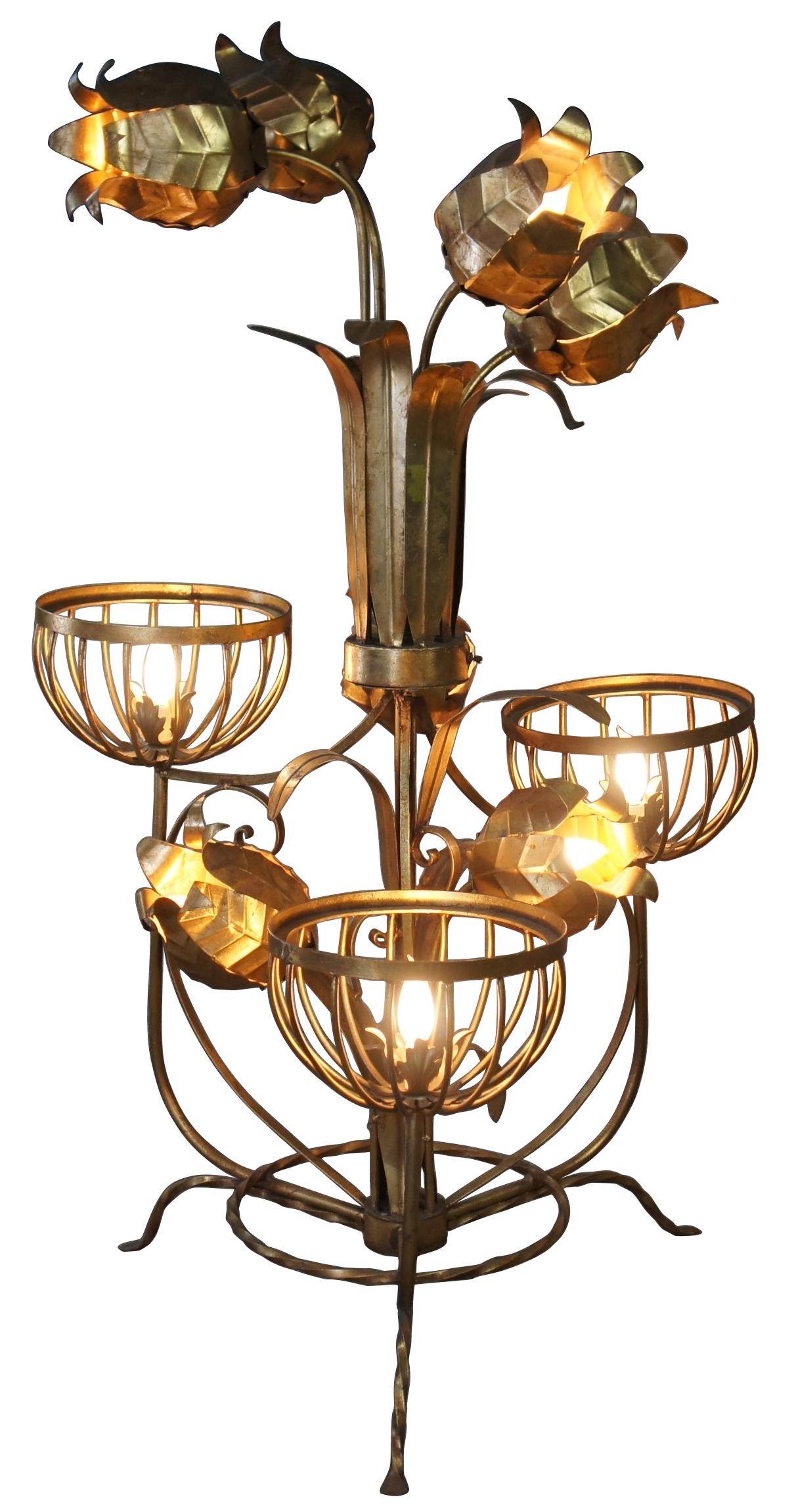 Monumental Regency style floor lamp. Made from tole and wrought iron with basket lamps and sculptural flowers over a tripod base. Includes 3 light settings. 

Globes would be 10