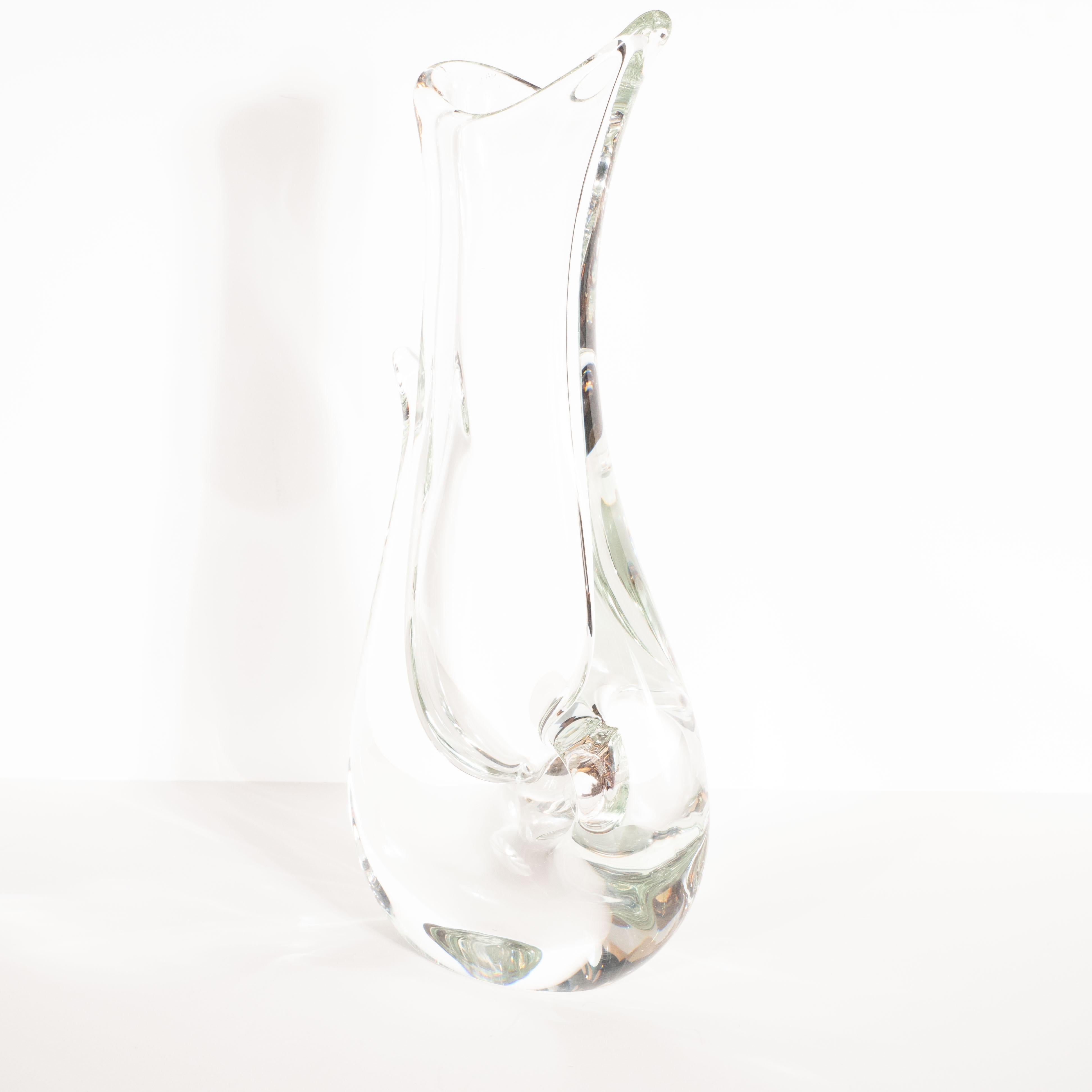This stunning and graphic vase was realized in Murano, Italy- the island off the coast of Venice renowned for centuries for its superlative glass production- circa 1970 by the esteemed studio Licio Zanetti. Realized in handblown translucent Murano