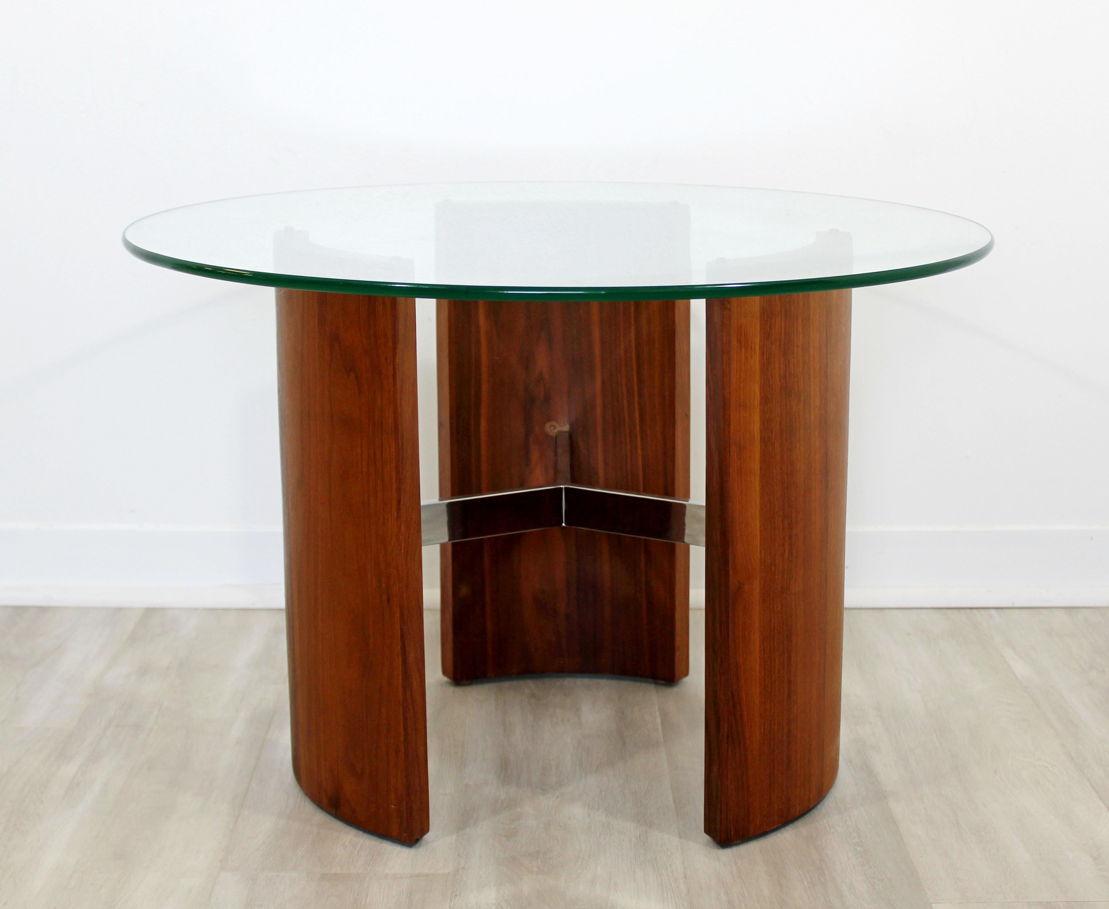 For your consideration is an incredible, Radius side or end table, with a sculptural walnut wood and chrome base and circular glass top, by Vladimir Kagan, circa 1960s. In very good condition. The dimensions are 30