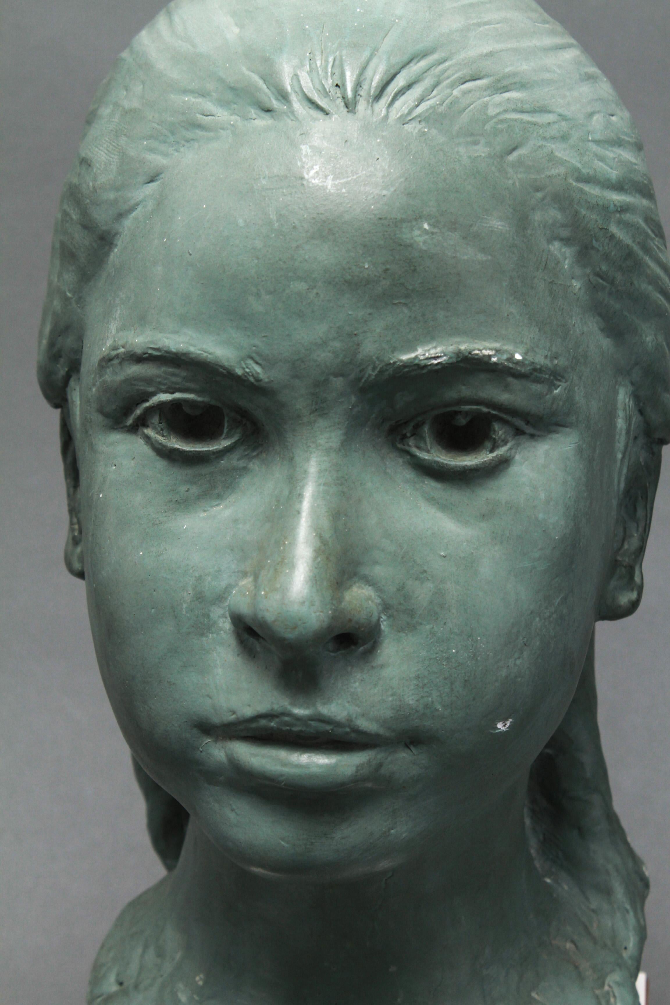 Mid-Century Modern composition sculpture bust of a young girl made in 1965. The piece is bearing an illegible signature and date on the reverse, possibly 