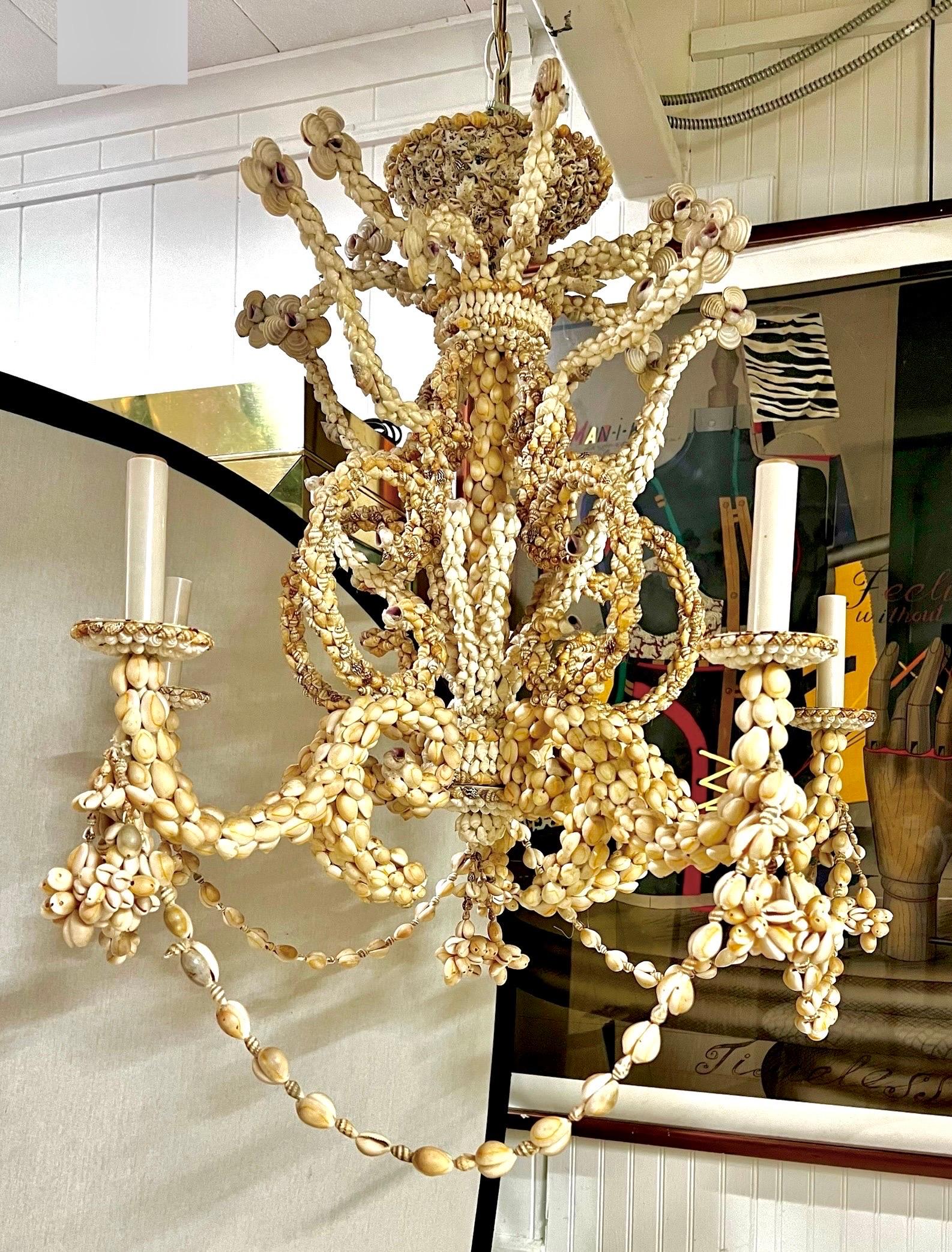 Iconic mid century modern five light sea shell chandelier from a stunning Amagansett, NY summer estate.  Stunning sea shell craftsmanship throughout.  Wired for US and in working order.  Note it will need to ship white glove versus parcel post