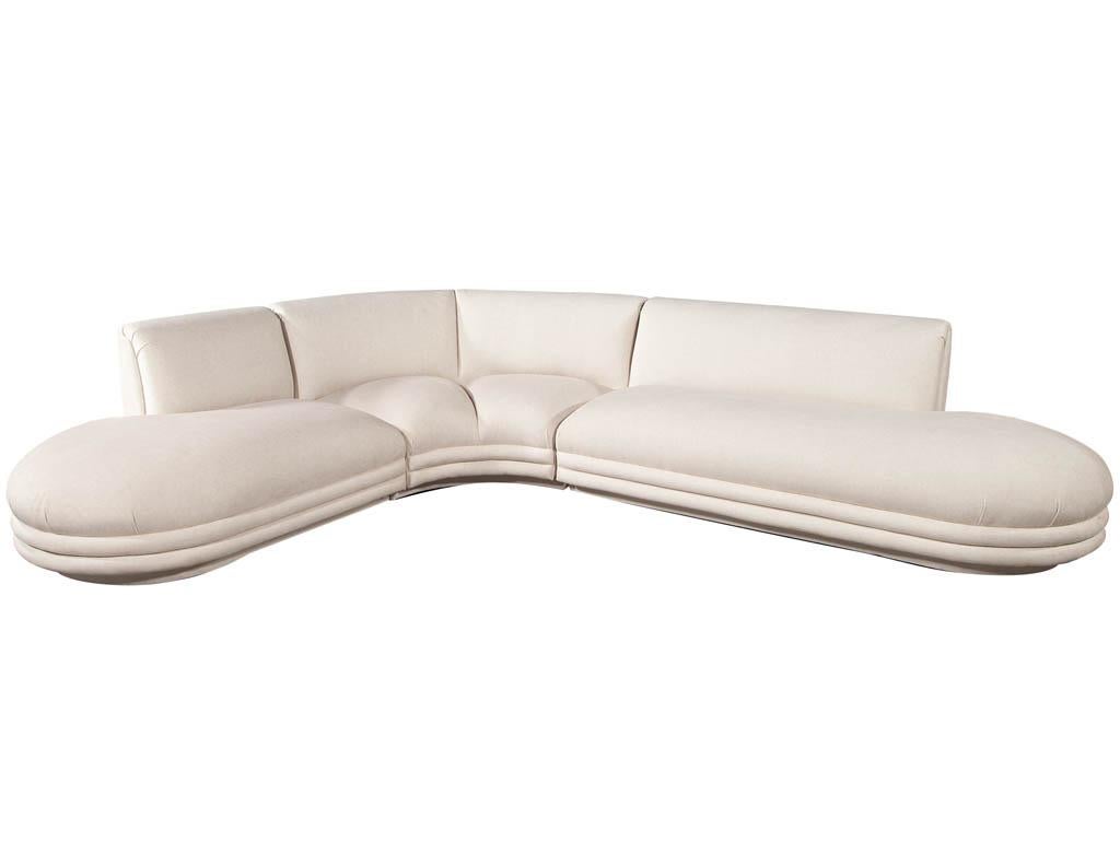 Mid-Century Modern sectional sofa attributed to Directional Vladimir Kagan. Completely restored in new designer beige fabric. Sofa is 3 pieces, featuring unique styling and sleek upholstery design.

Measures: W: 126” x 100” - seat height 18” seat